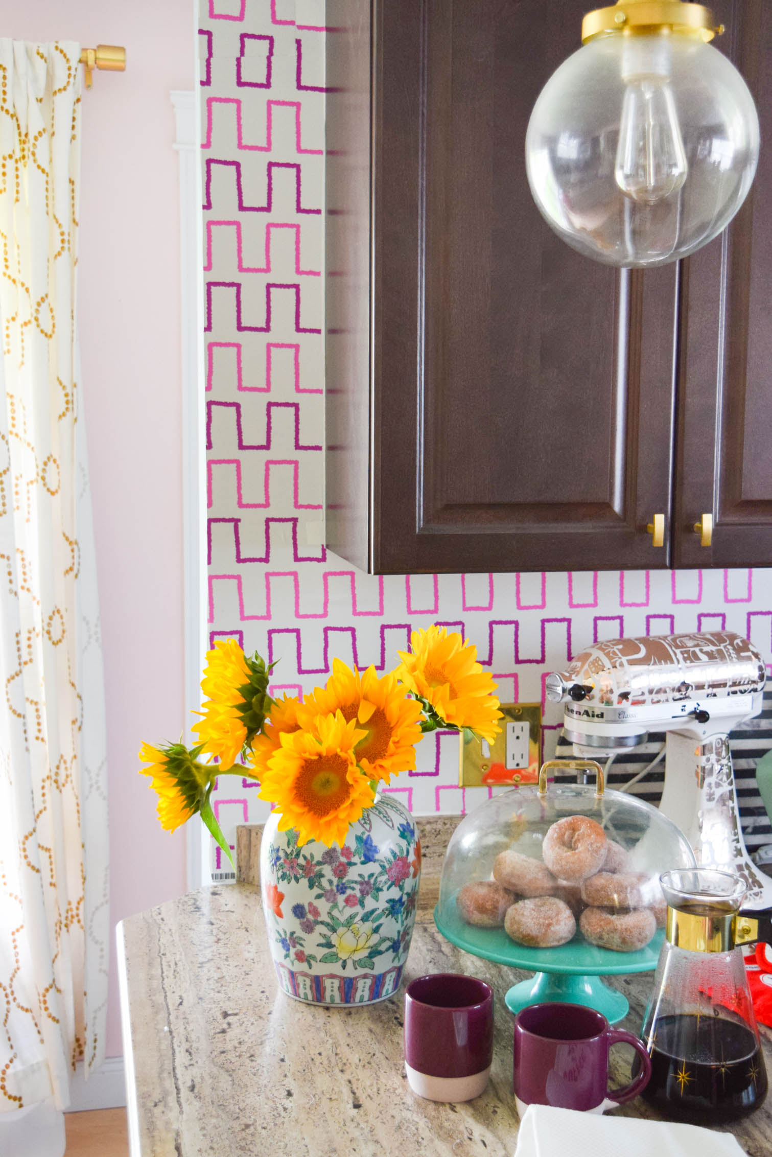 Life is too short to live with ugly rental kitchens. Fix it with a Removable Kitchen Wallpaper Backsplashusing a vibrant pattern from Spoonflower. All you need to get started are the measurements of your space, and the pattern you want! #wallpaper #removablewallpaper #backsplash #renterfriendly #kitchenupgrades