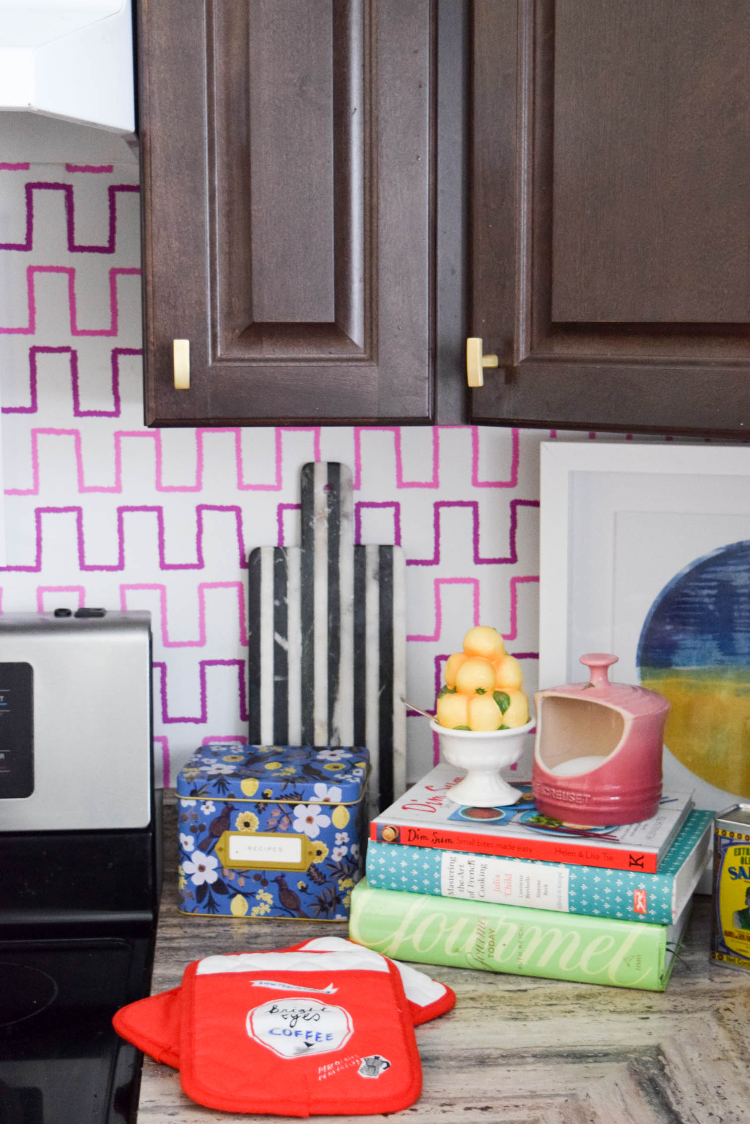 Life is too short to live with ugly rental kitchens. Fix it with a Removable Kitchen Wallpaper Backsplashusing a vibrant pattern from Spoonflower. All you need to get started are the measurements of your space, and the pattern you want! #wallpaper #removablewallpaper #backsplash #renterfriendly #kitchenupgrades