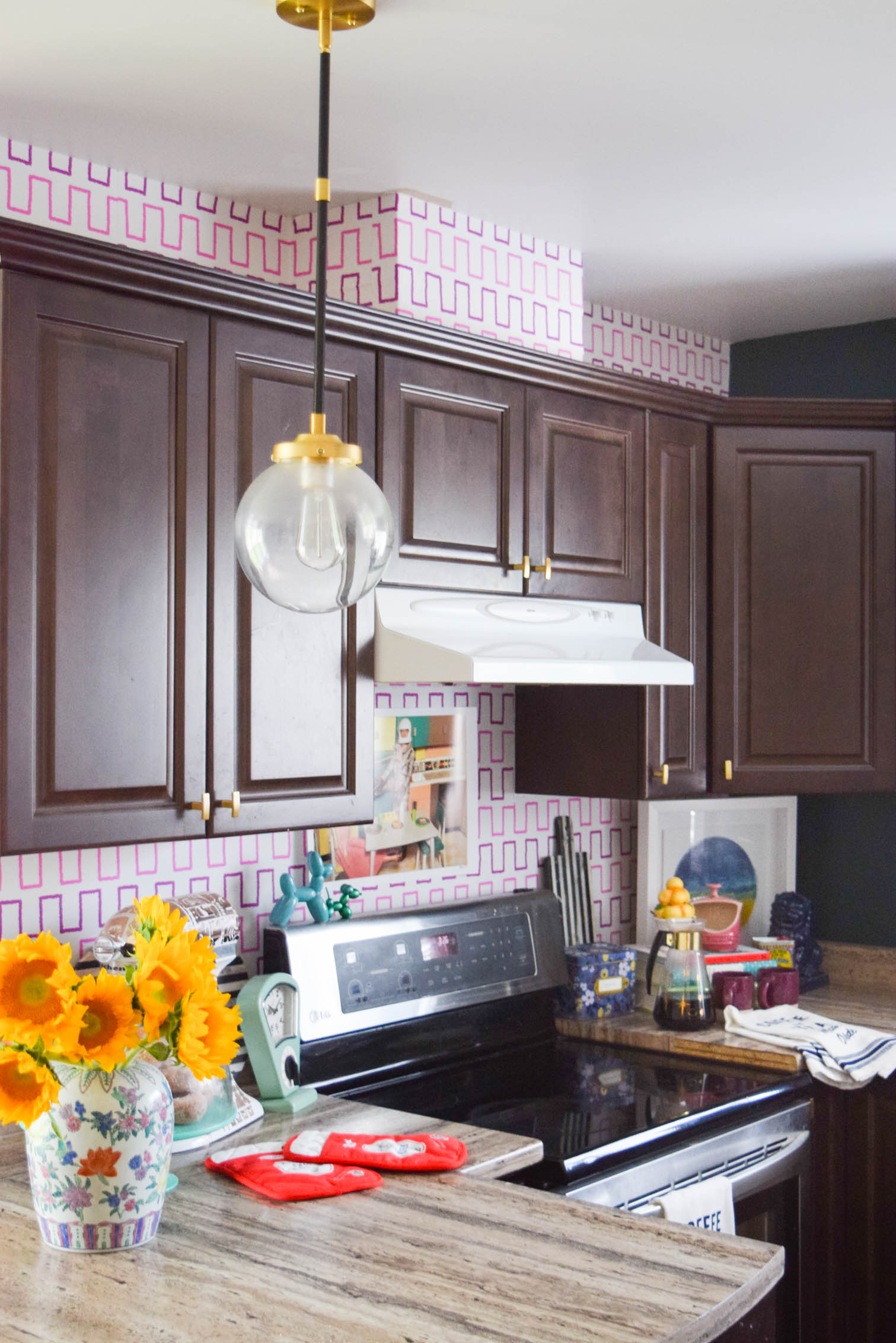 Life is too short to live with ugly rental kitchens. Fix it with a Removable Kitchen Wallpaper Backsplashusing a vibrant pattern from Spoonflower. All you need to get started are the measurements of your space, and the pattern you want! #wallpaper #removablewallpaper #backsplash #renterfriendly #kitchenupgrades