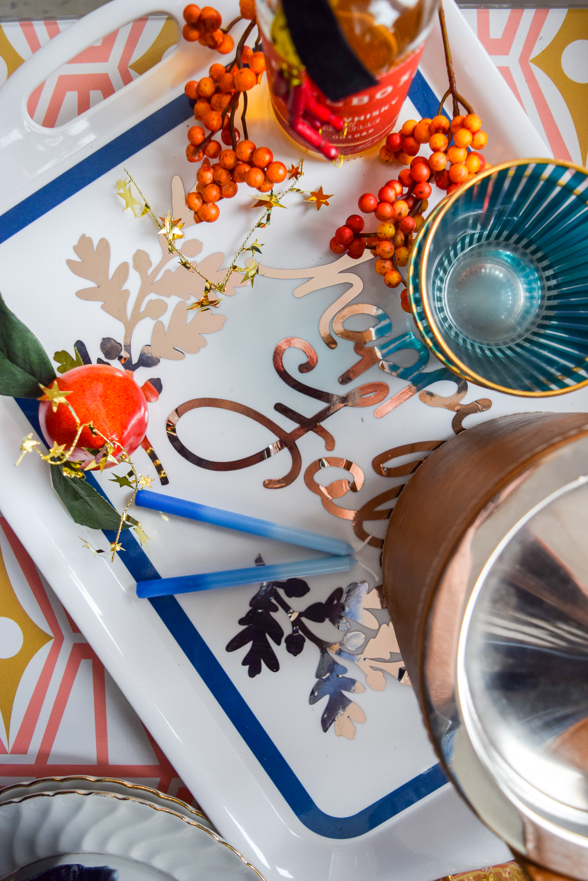 overtop shot of a tray with fall berries and colourful cups