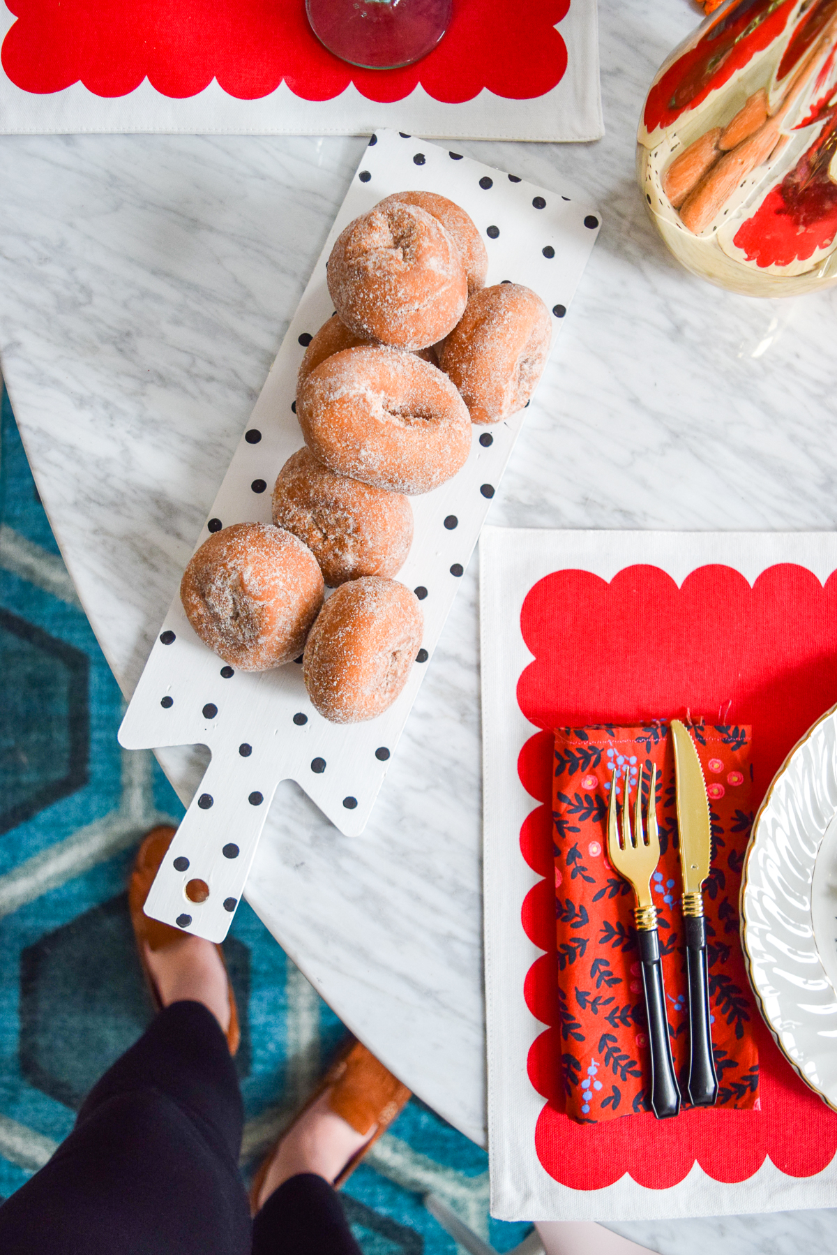 donuts on a black and white polka dot tray