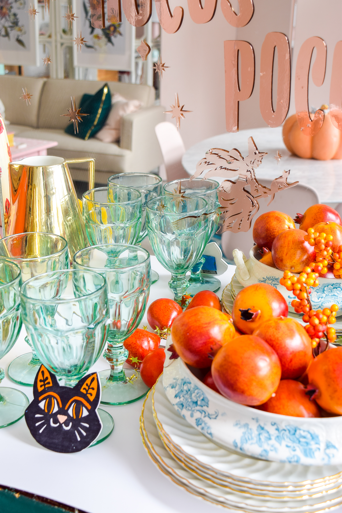 close-up shot of blue goblets and pomegranates on a counter