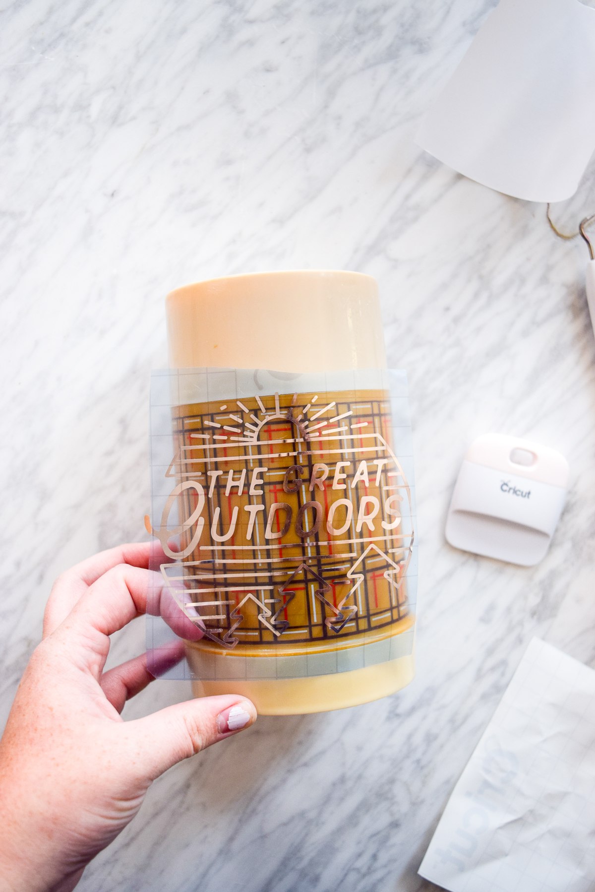 applying a vinyl decal using transfer tape to a thermos