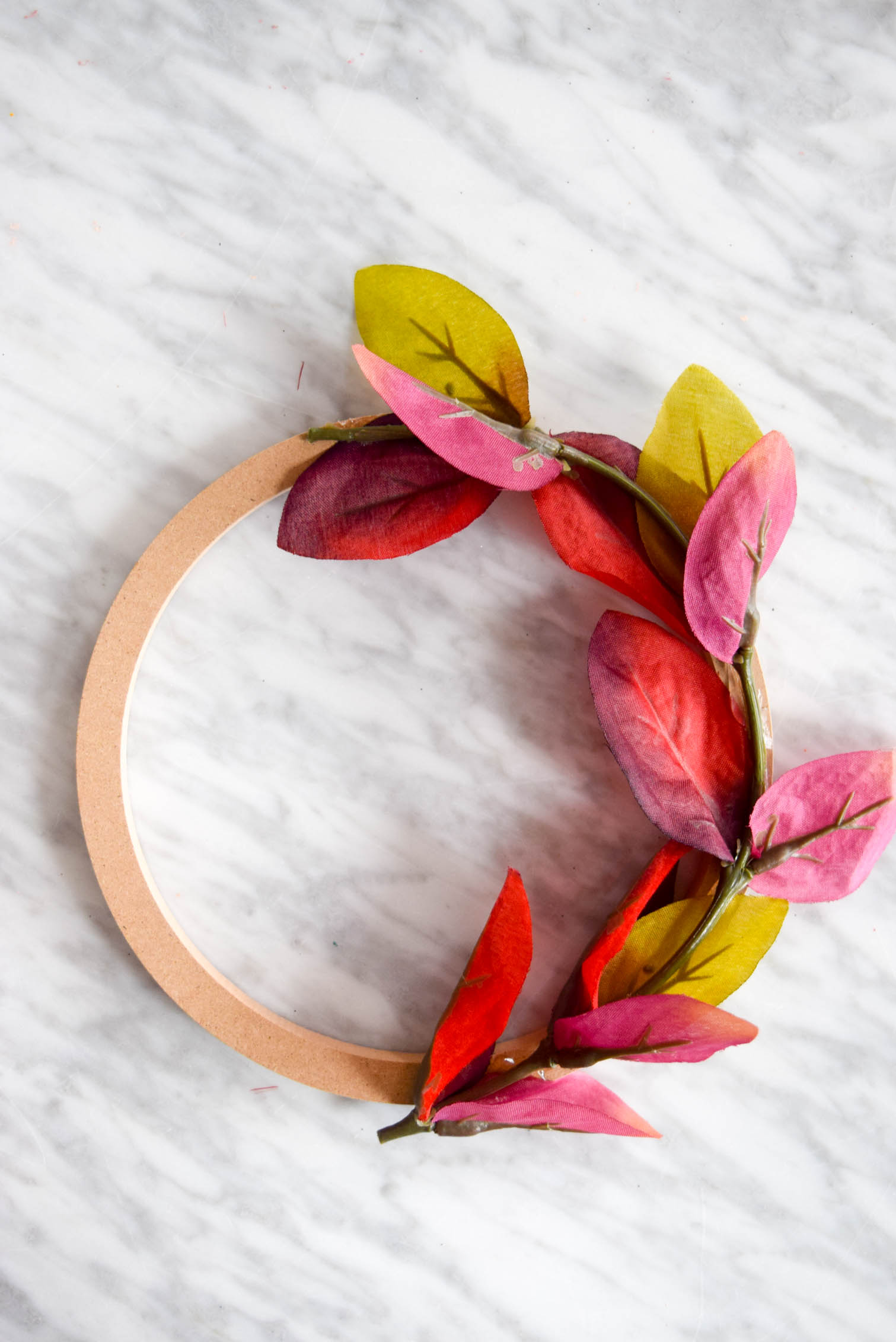 half assembled wreath on a marble table