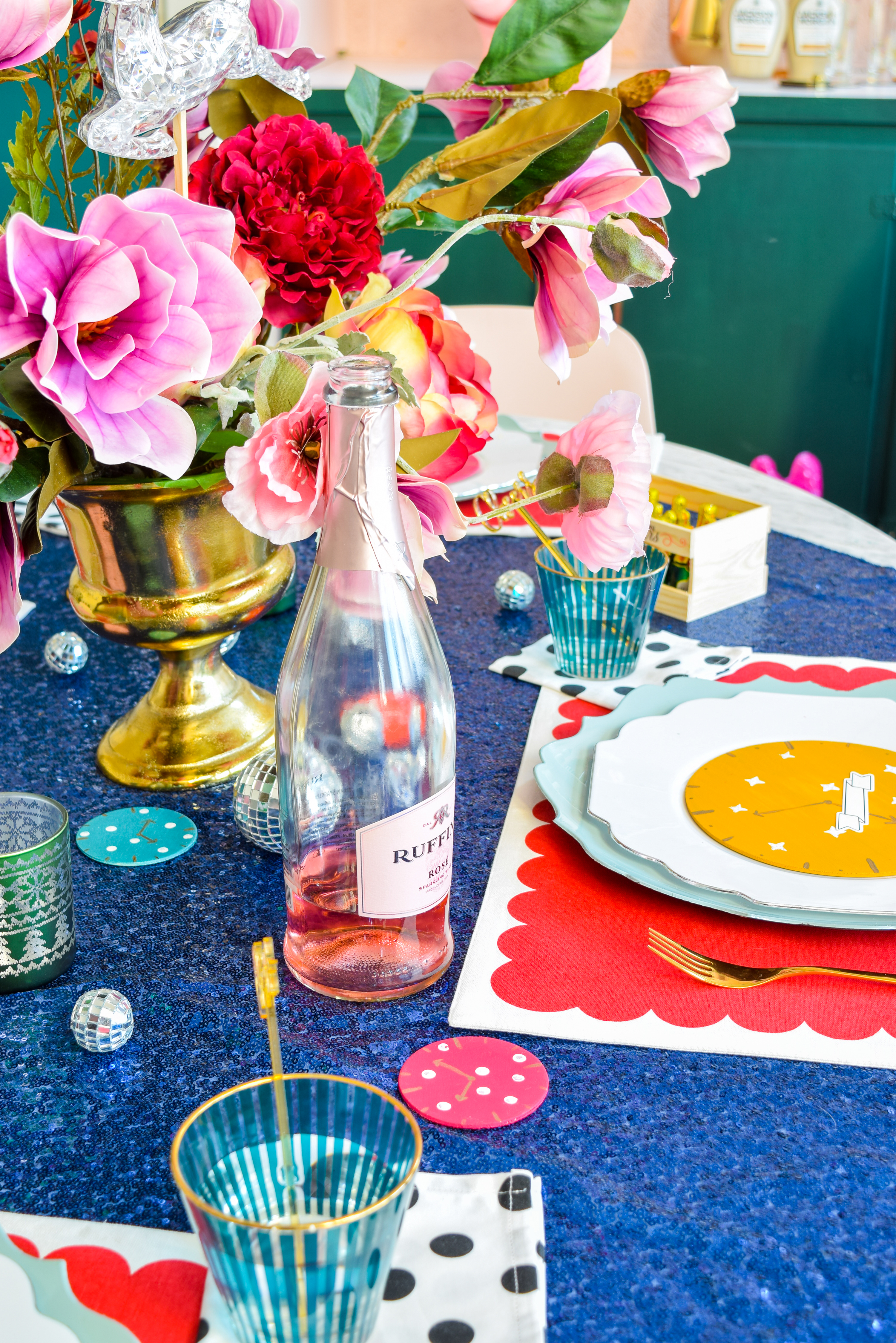  For my Kate Spade New Years Eve Tablescape you bet I went glitzy and colourful, and invited an inflatable flamingo in a Santa hat. Come see what else is shaking!