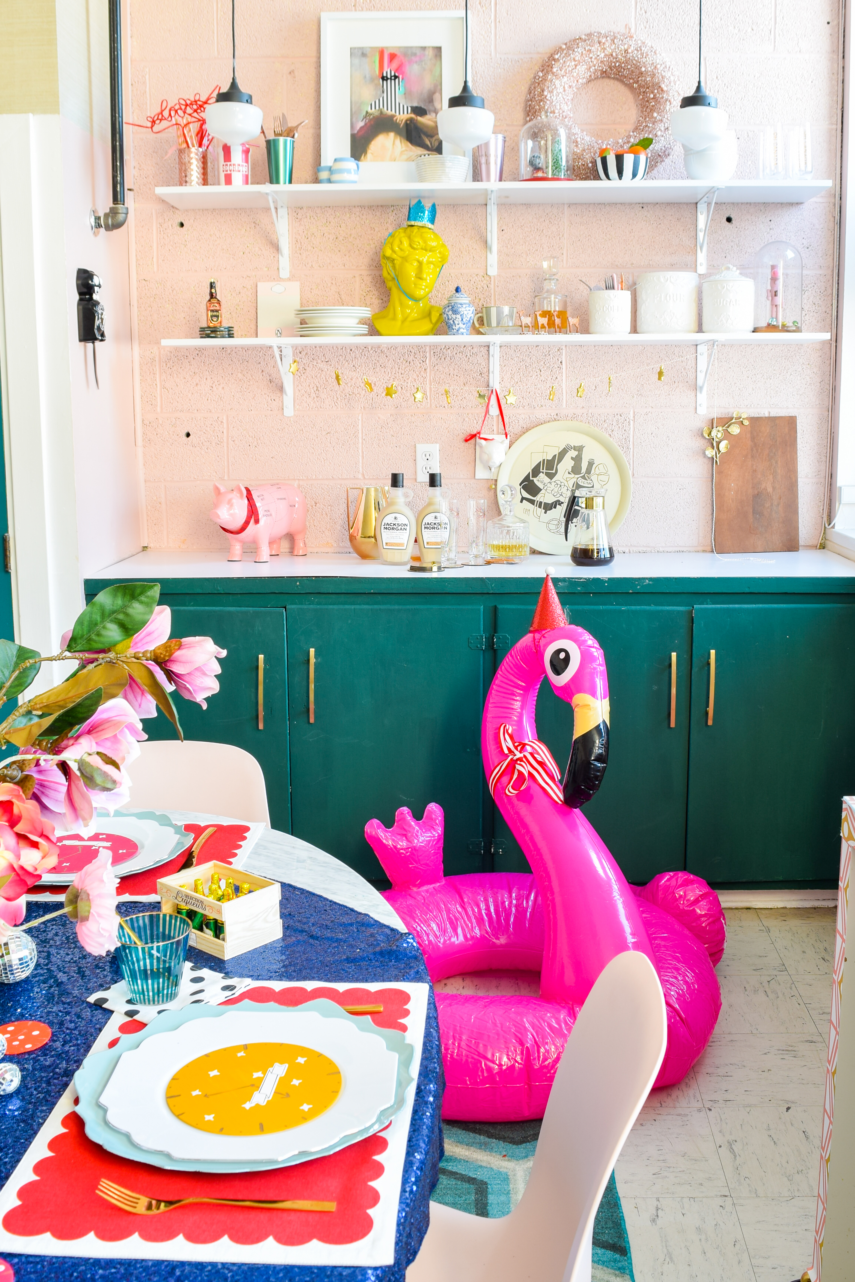  For my Kate Spade New Years Eve Tablescape you bet I went glitzy and colourful, and invited an inflatable flamingo in a Santa hat. Come see what else is shaking!