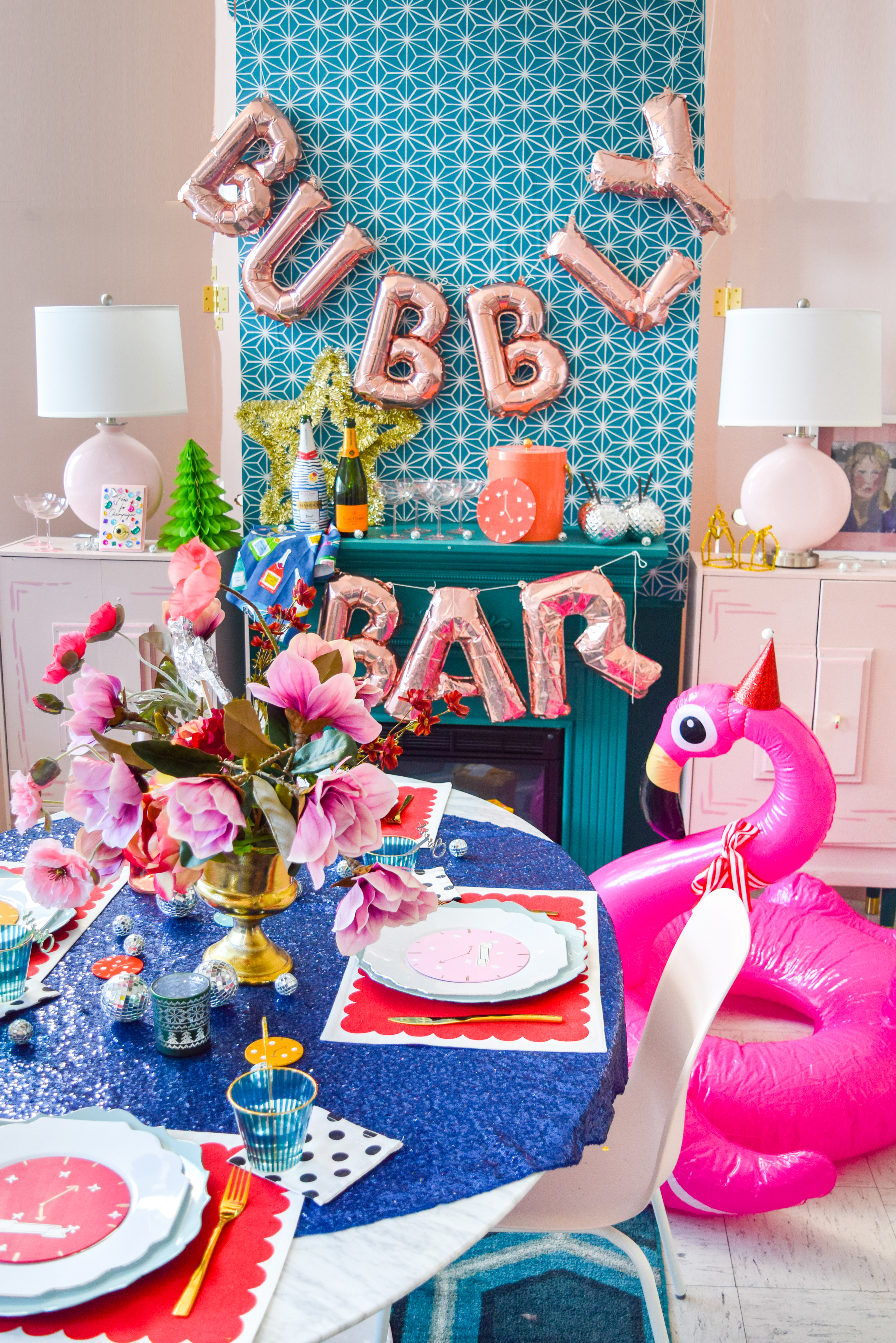  For my Kate Spade New Years Eve Tablescape you bet I went glitzy and colourful, and invited an inflatable flamingo in a Santa hat. Come see what else is shaking!