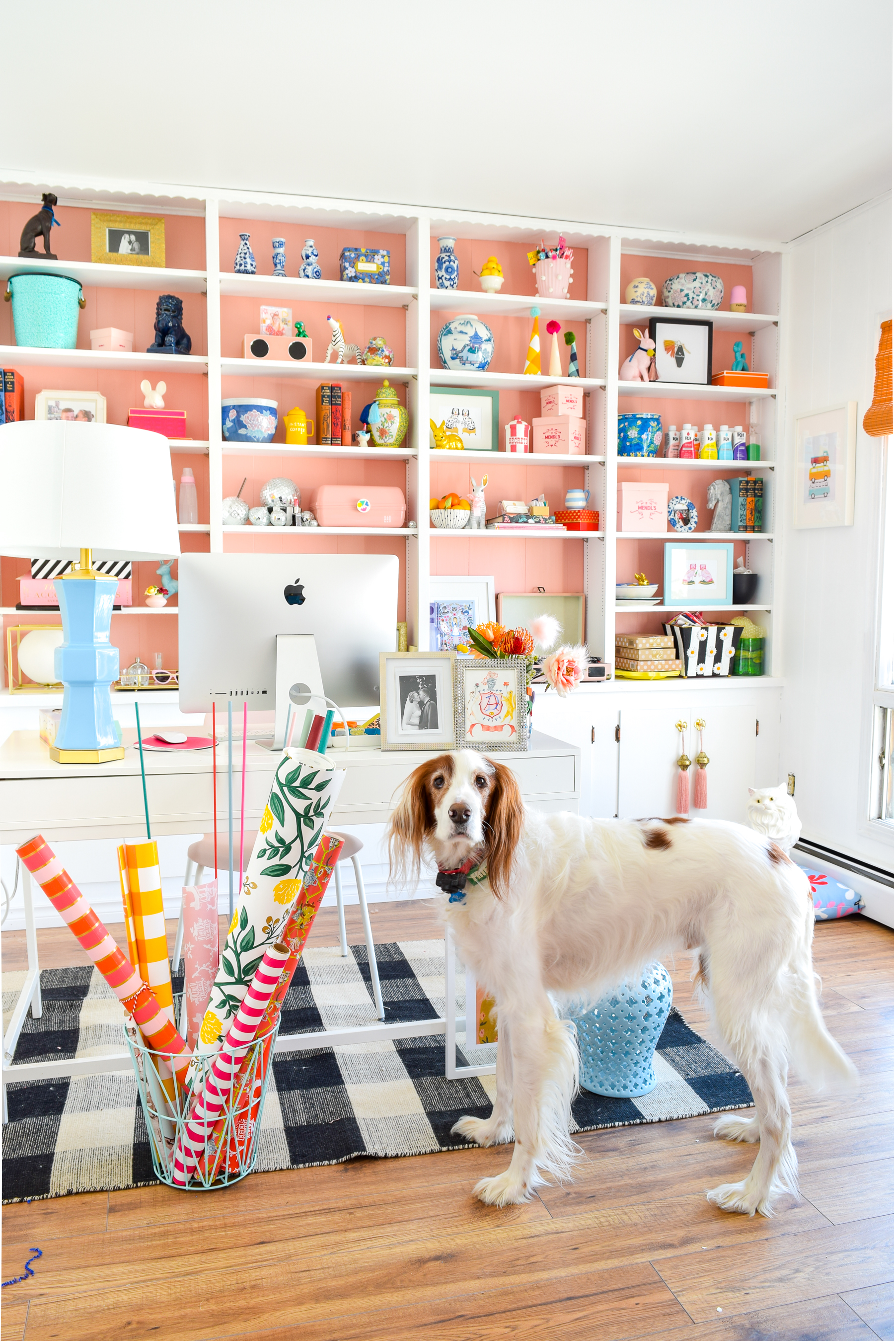 We painted our wood panelling in a bright white and Noble Blush (pink) from BEHR paint, to create a feminine and colourful home office space. 