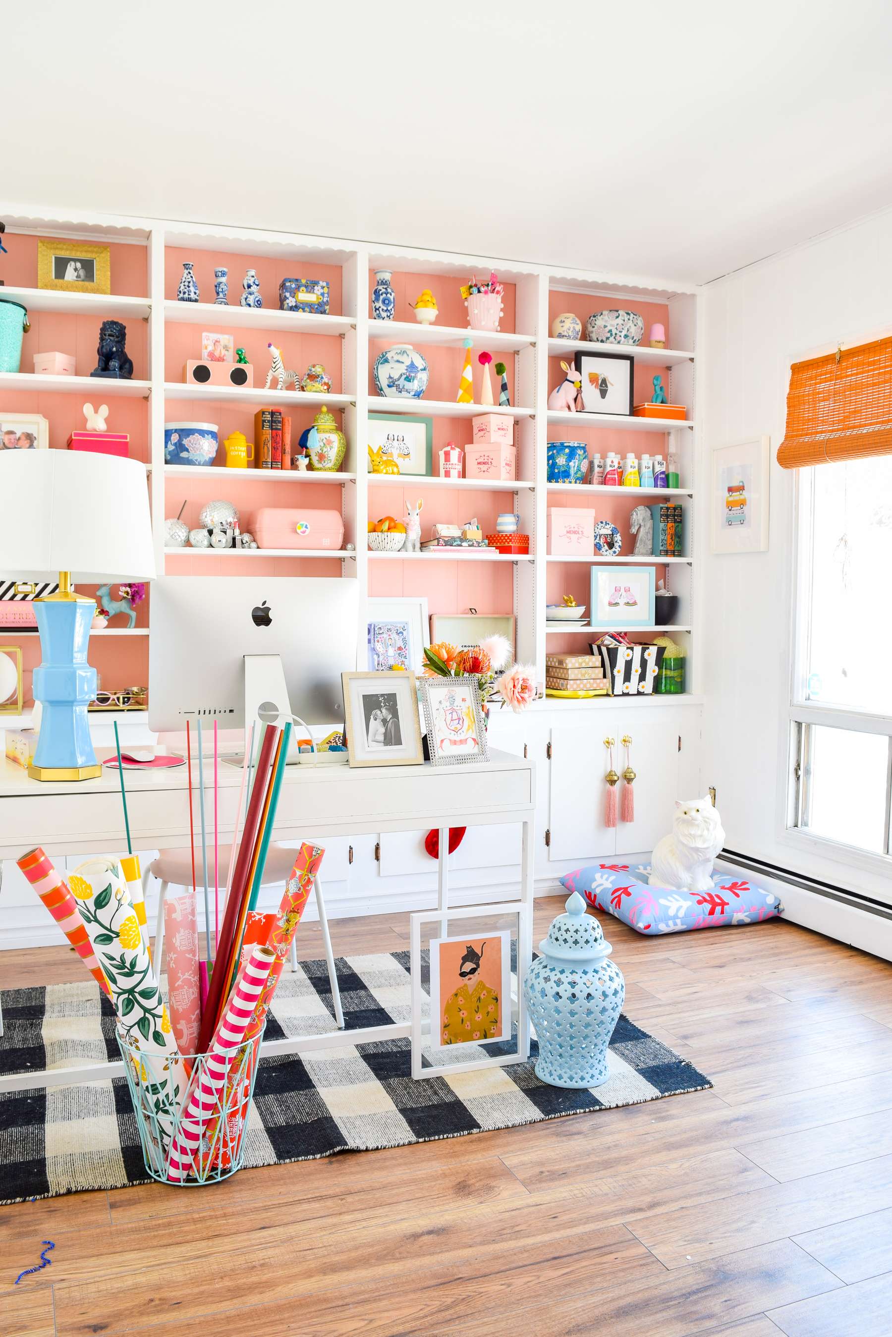 We painted our wood panelling in a bright white and Noble Blush (pink) from BEHR paint, to create a feminine and colourful home office space. 