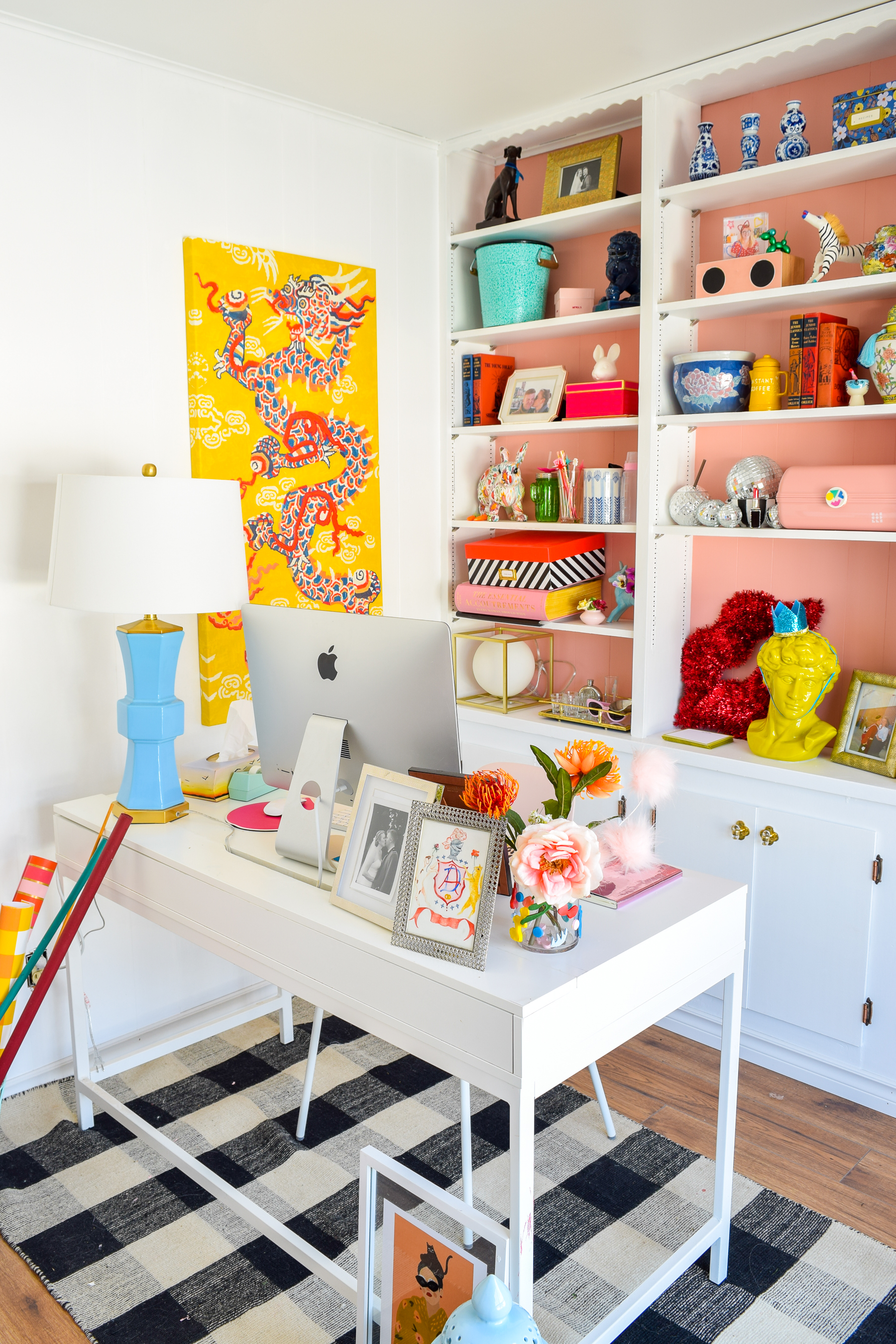 We painted our wood panelling in a bright white and Noble Blush (pink) from BEHR paint, to create a feminine and colourful home office space. 