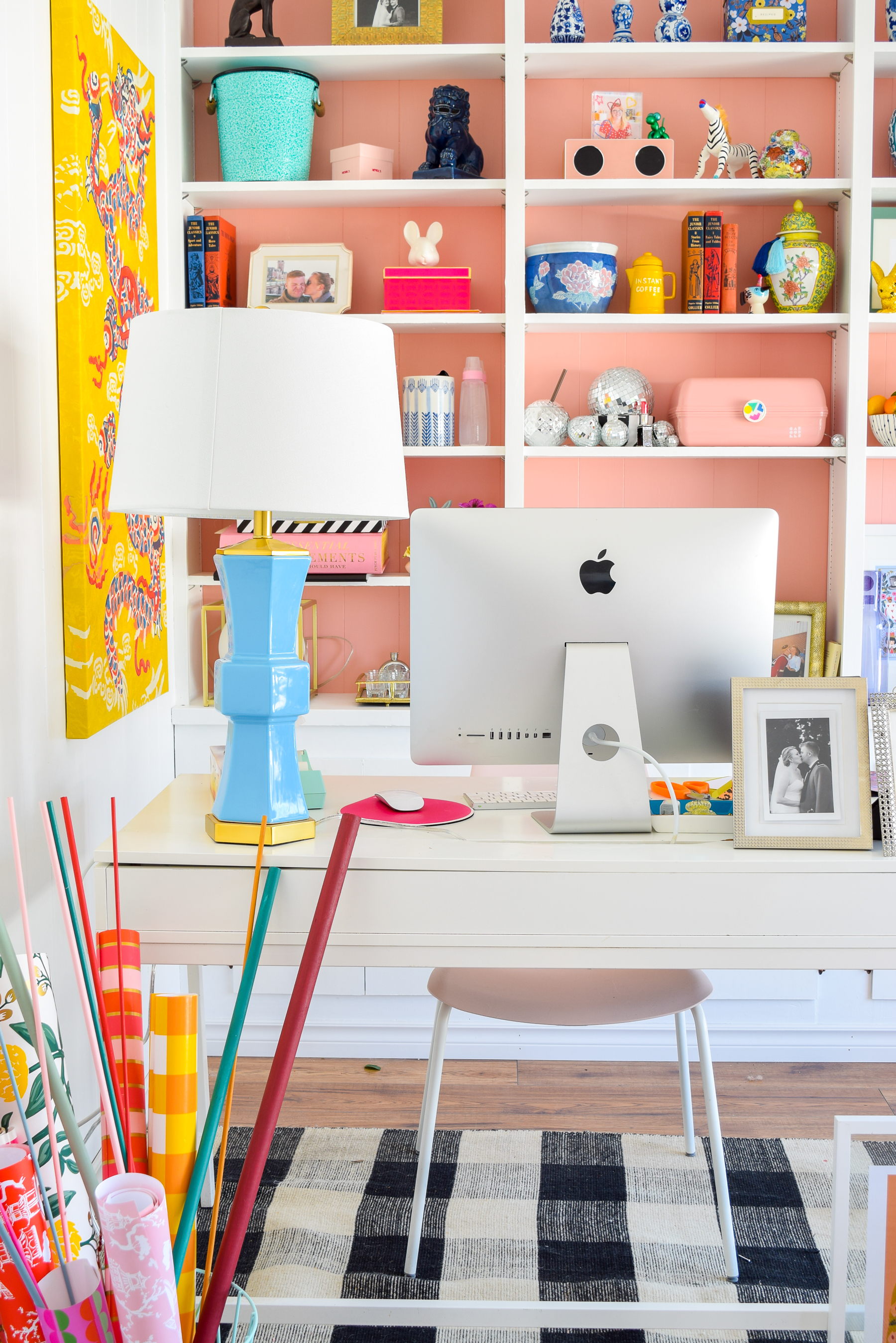 We painted our wood panelling in a bright white and Noble Blush (pink) from BEHR paint, to create a feminine and colourful home office space. 