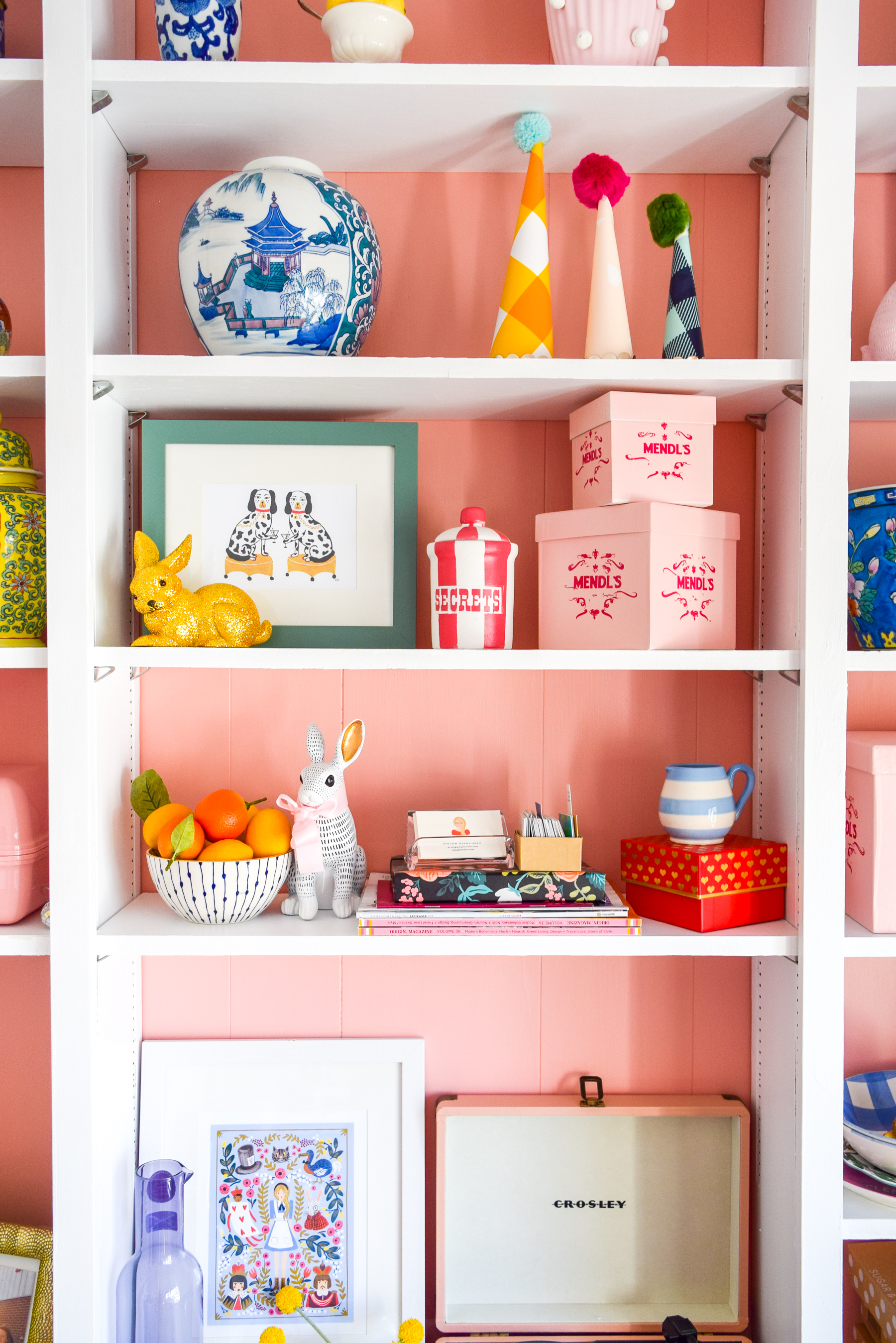 We painted our wood panelling in a bright white and Noble Blush (pink) from BEHR paint, to create a feminine and colourful home office space. 