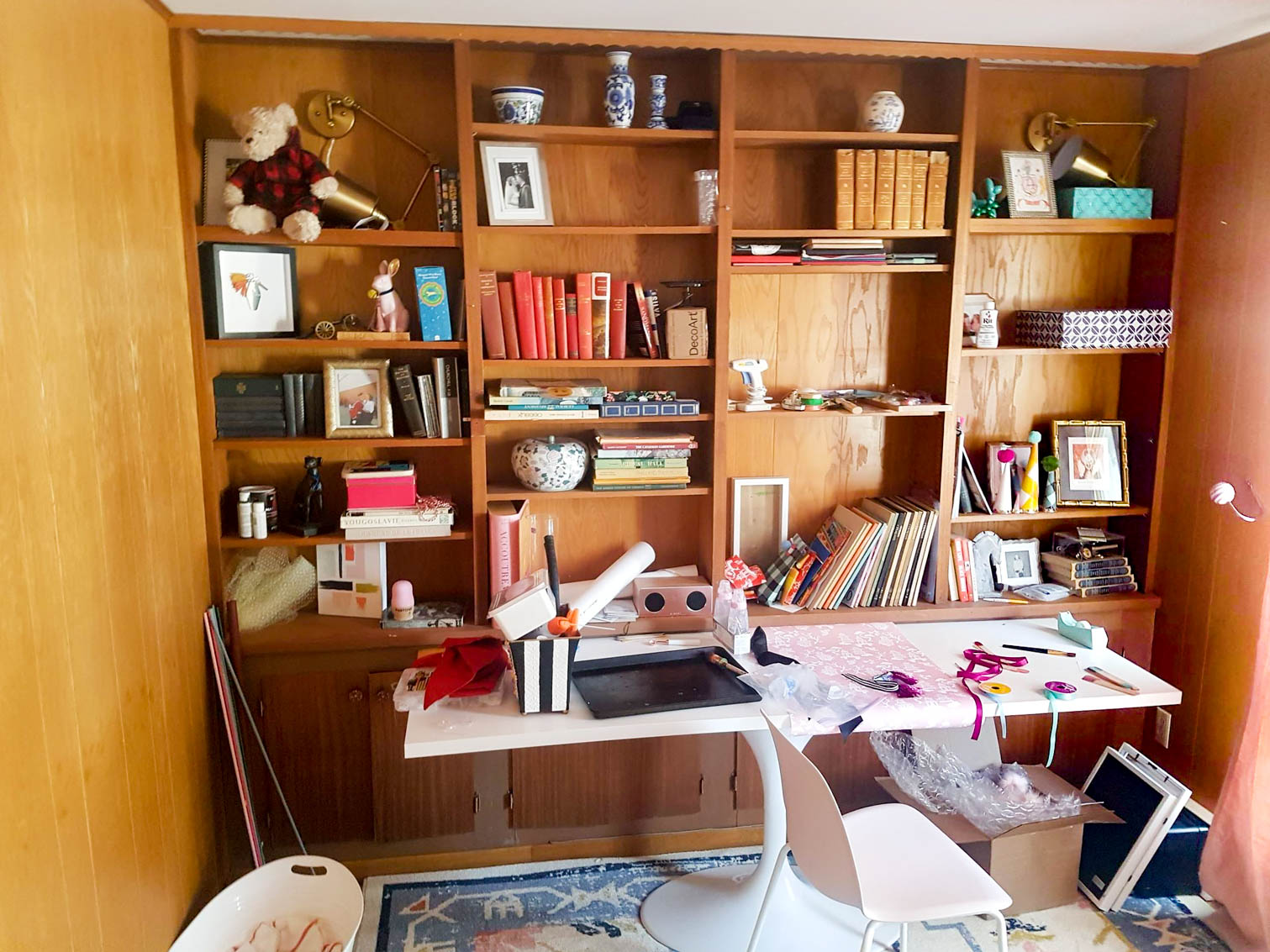 We painted our wood panelling in a bright white and Noble Blush (pink) from BEHR paint, to create a feminine and colourful home office space. 