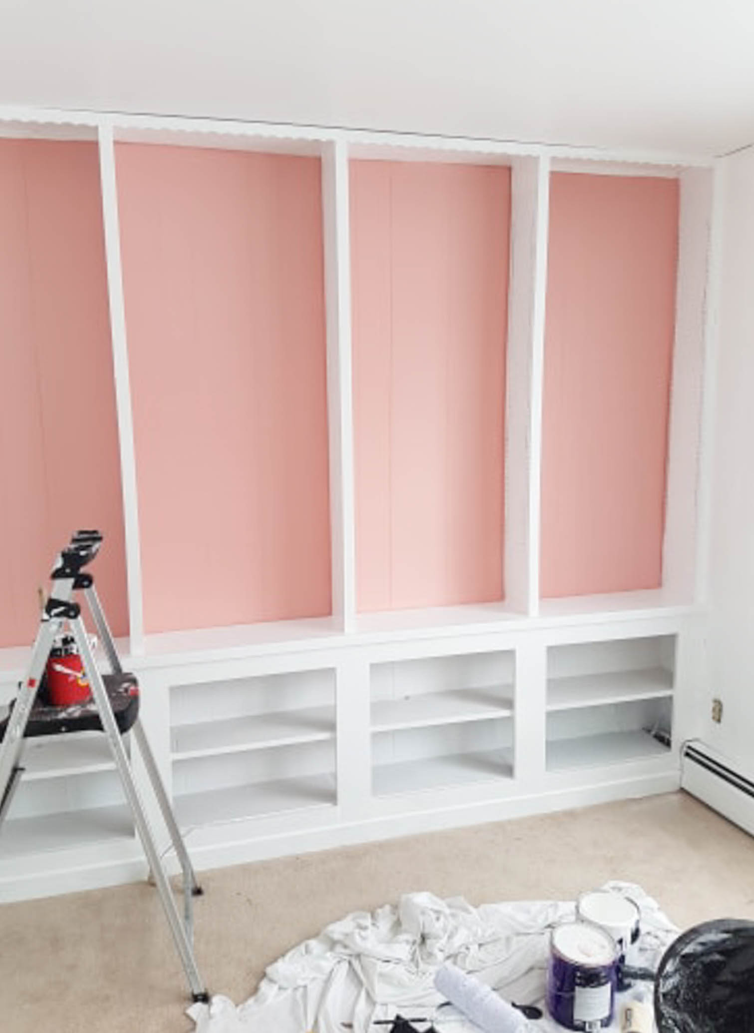 We painted our wood panelling in a bright white and Noble Blush (pink) from BEHR paint, to create a feminine and colourful home office space. 