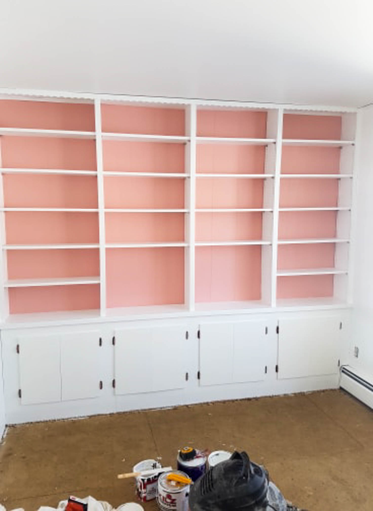 We painted our wood panelling in a bright white and Noble Blush (pink) from BEHR paint, to create a feminine and colourful home office space. 