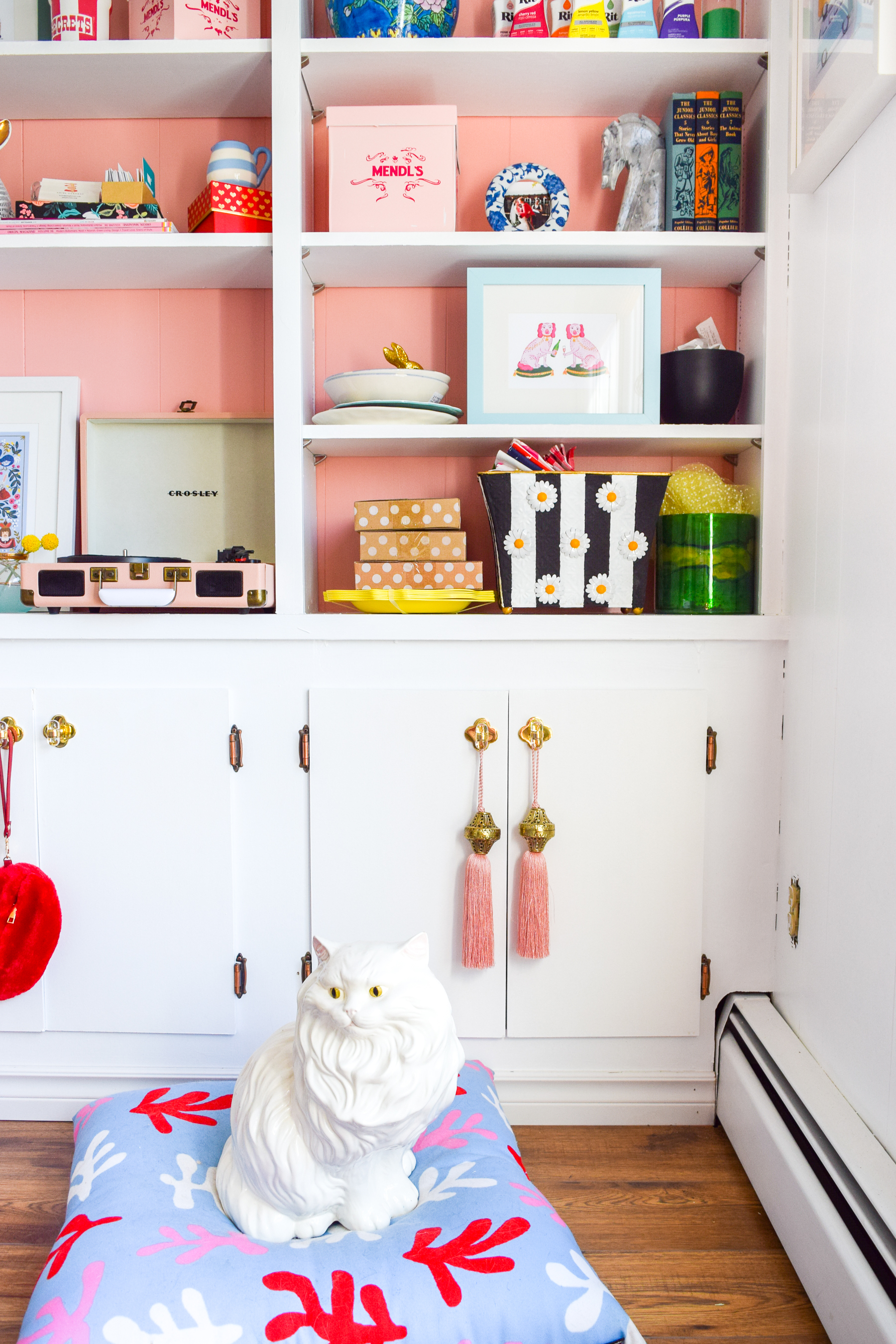 We painted our wood panelling in a bright white and Noble Blush (pink) from BEHR paint, to create a feminine and colourful home office space. 