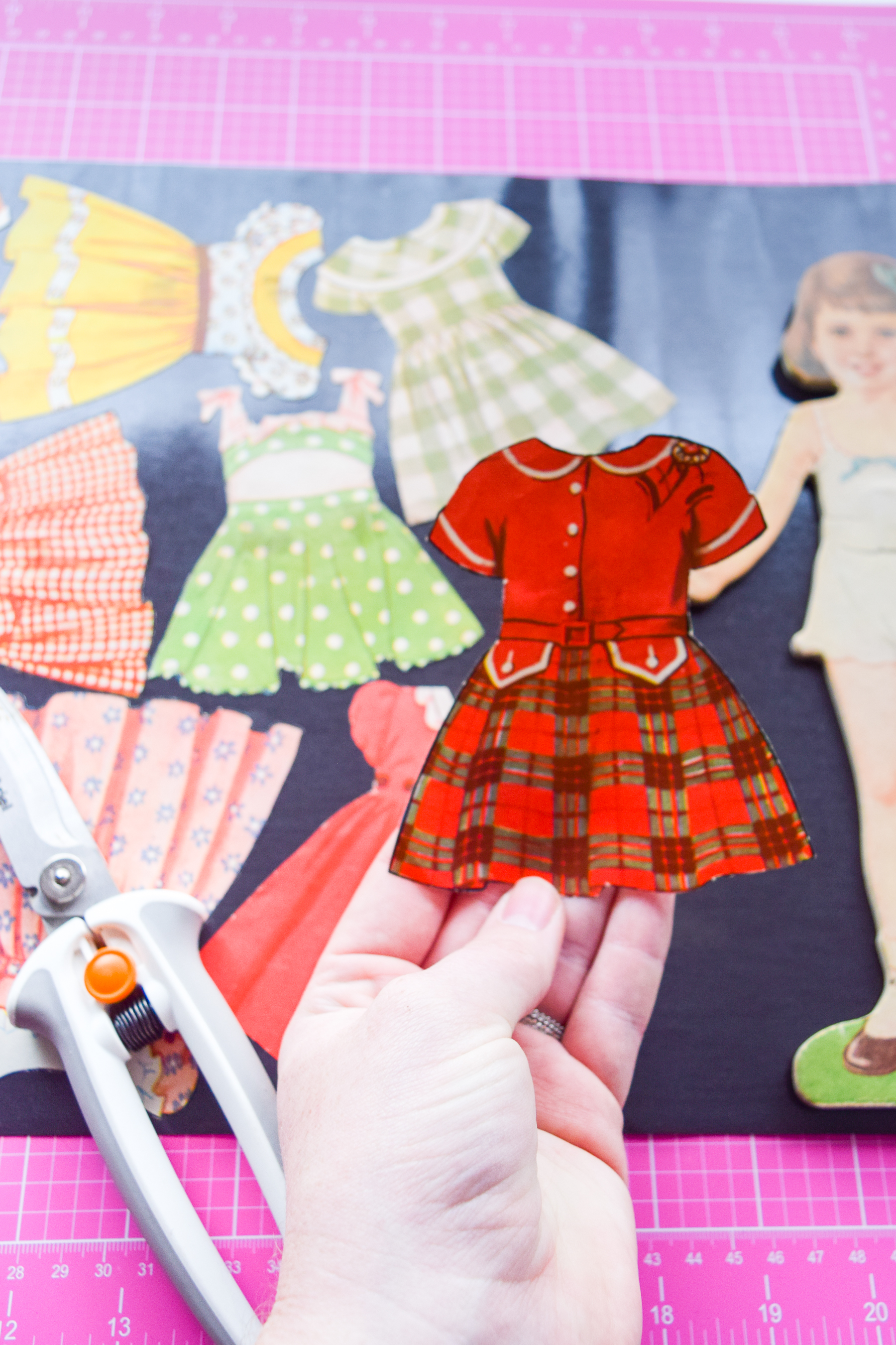 Got an old paper doll set? Add some magnetic sheeting them, and stick them to your fridge for a fun set of DIY retro doll fridge magnets.