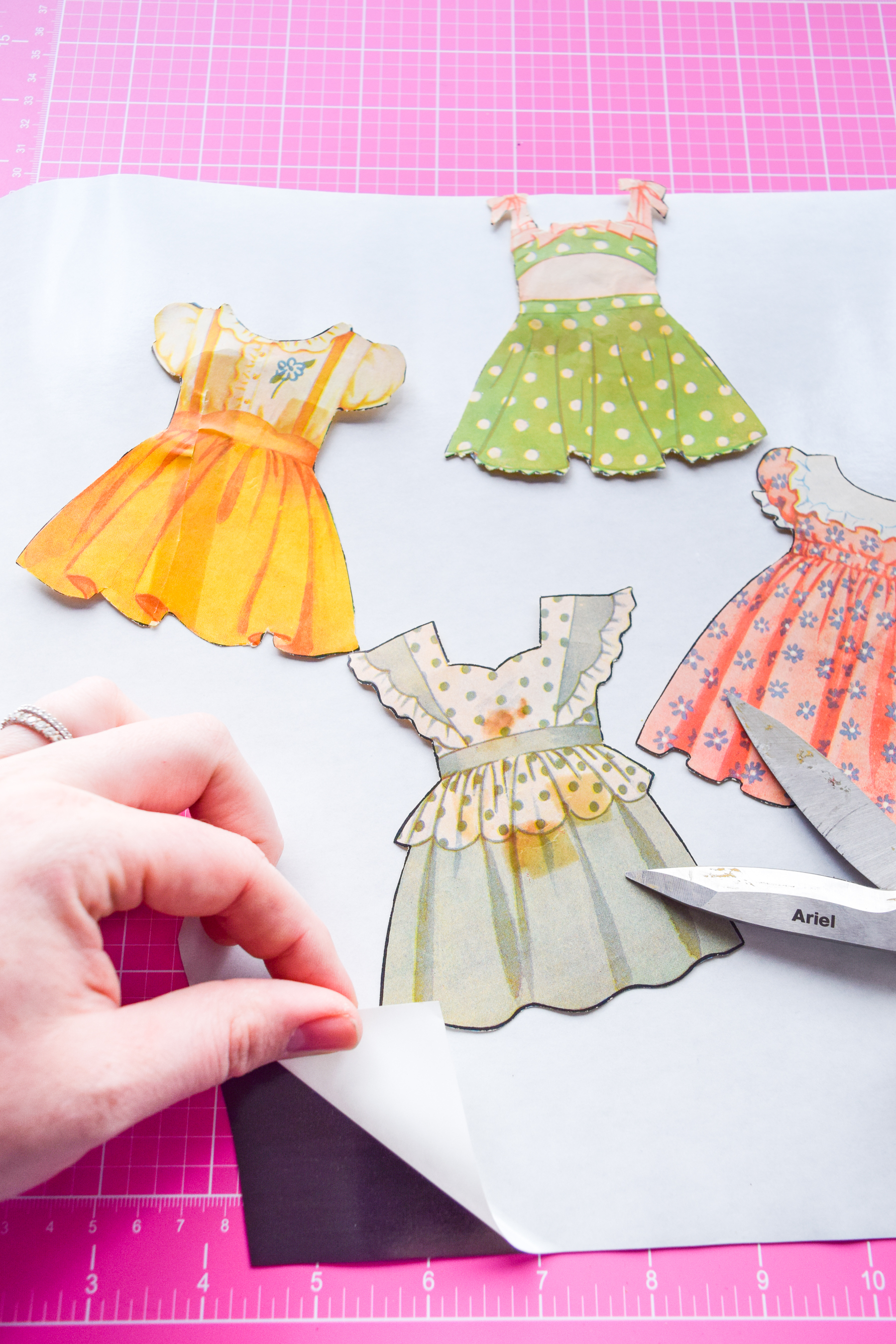 Got an old paper doll set? Add some magnetic sheeting them, and stick them to your fridge for a fun set of DIY retro doll fridge magnets.