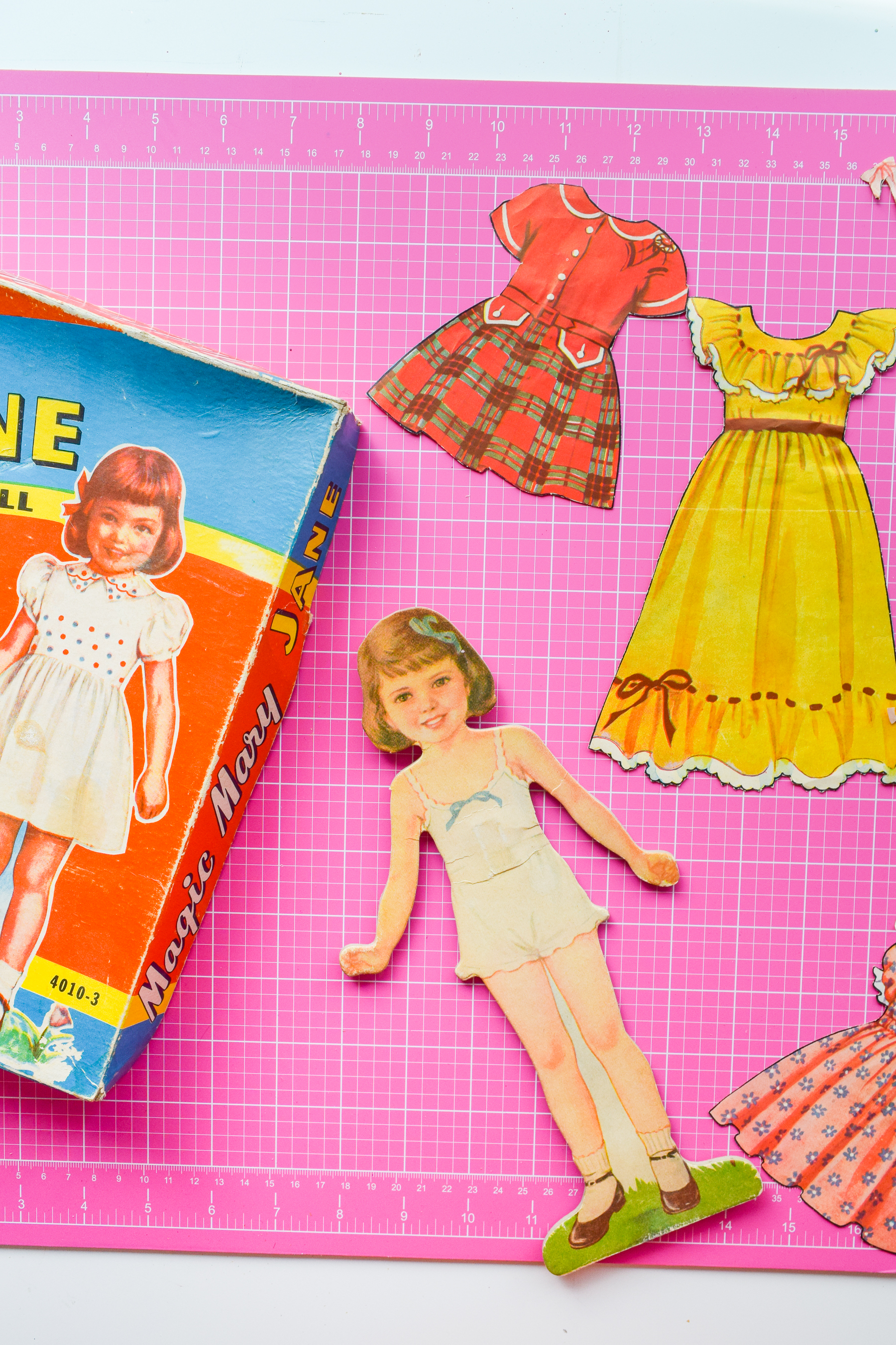 Got an old paper doll set? Add some magnetic sheeting them, and stick them to your fridge for a fun set of DIY retro doll fridge magnets.