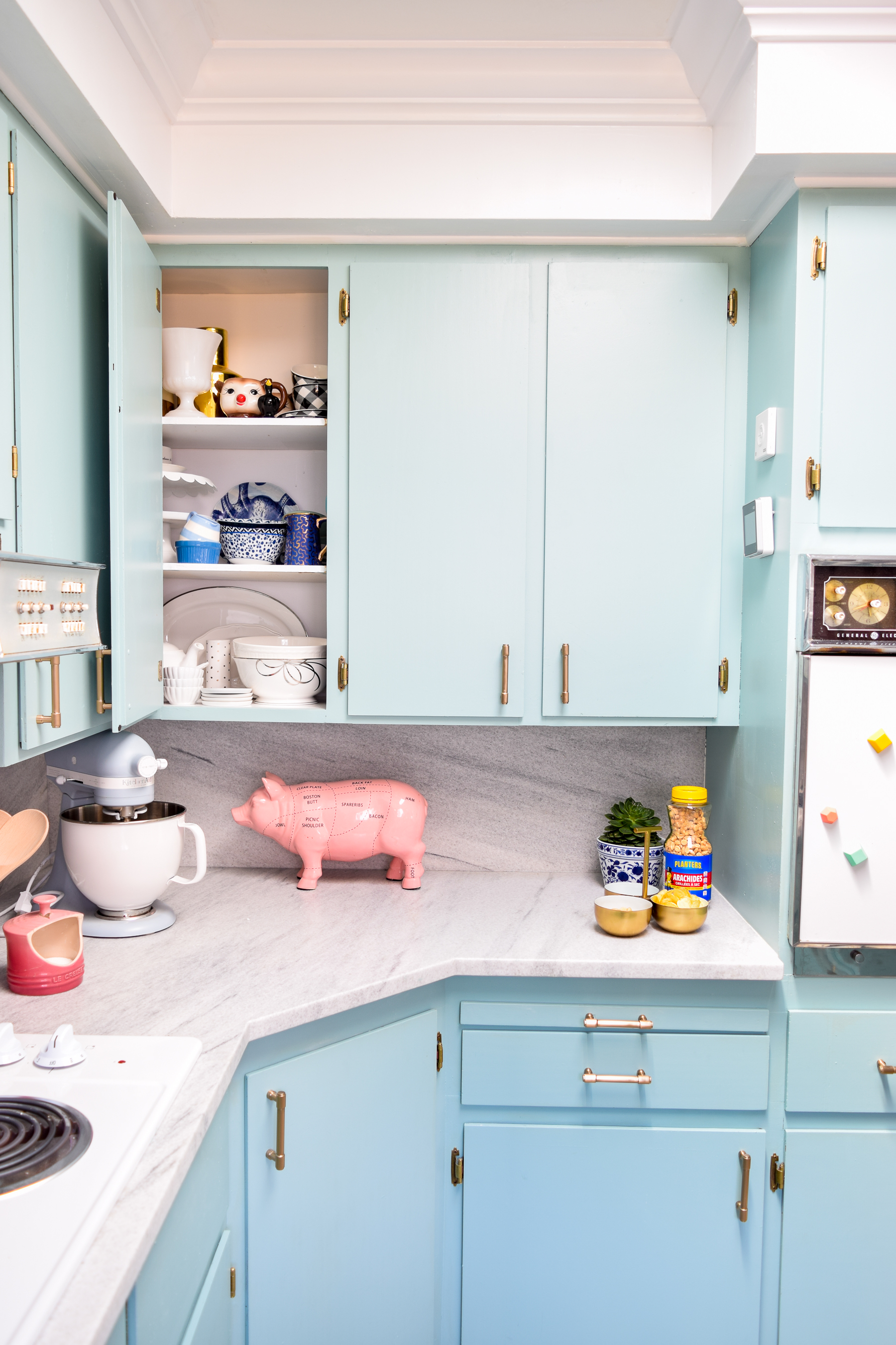 Our retro glam kitchen renovations are done! Come see how we transformed our dated kitchen, into a modern oasis, full of colour and pattern.