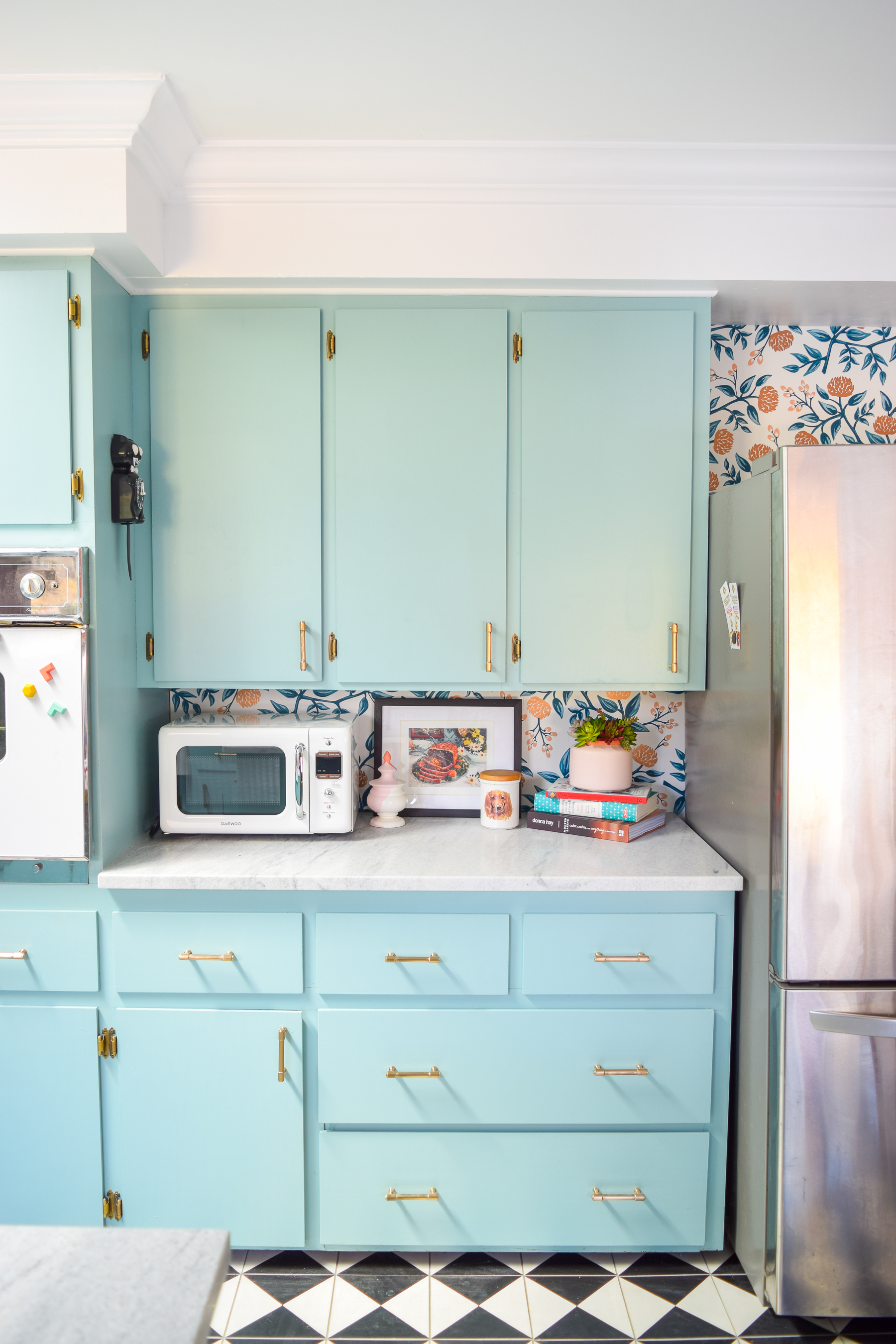 Our retro glam kitchen renovations are done! Come see how we transformed our dated kitchen, into a modern oasis, full of colour and pattern.