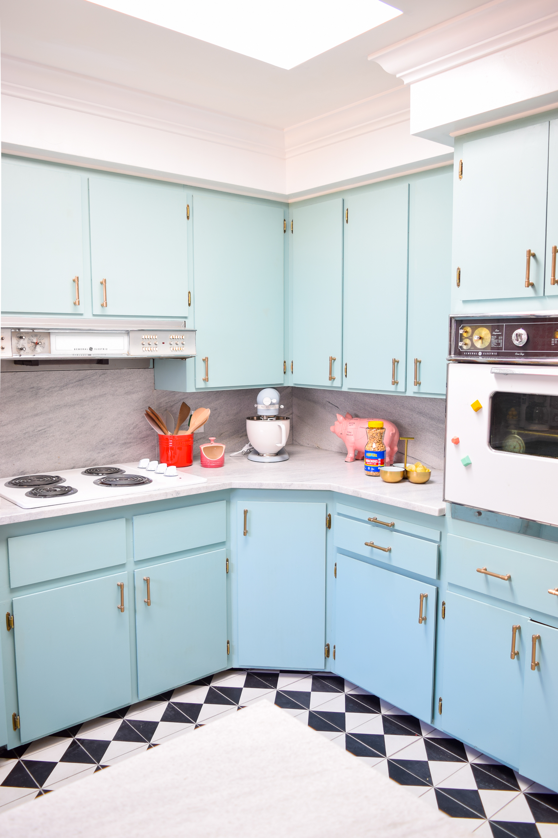 Our retro glam kitchen renovations are done! Come see how we transformed our dated kitchen, into a modern oasis, full of colour and pattern.