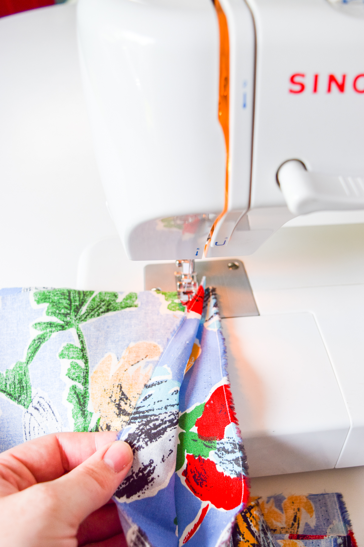 Sewing a DIY Table Skirt for a desk, is a great way to hide a tired and old work station. It's easy to sew, and adds a pop of pattern to any space.