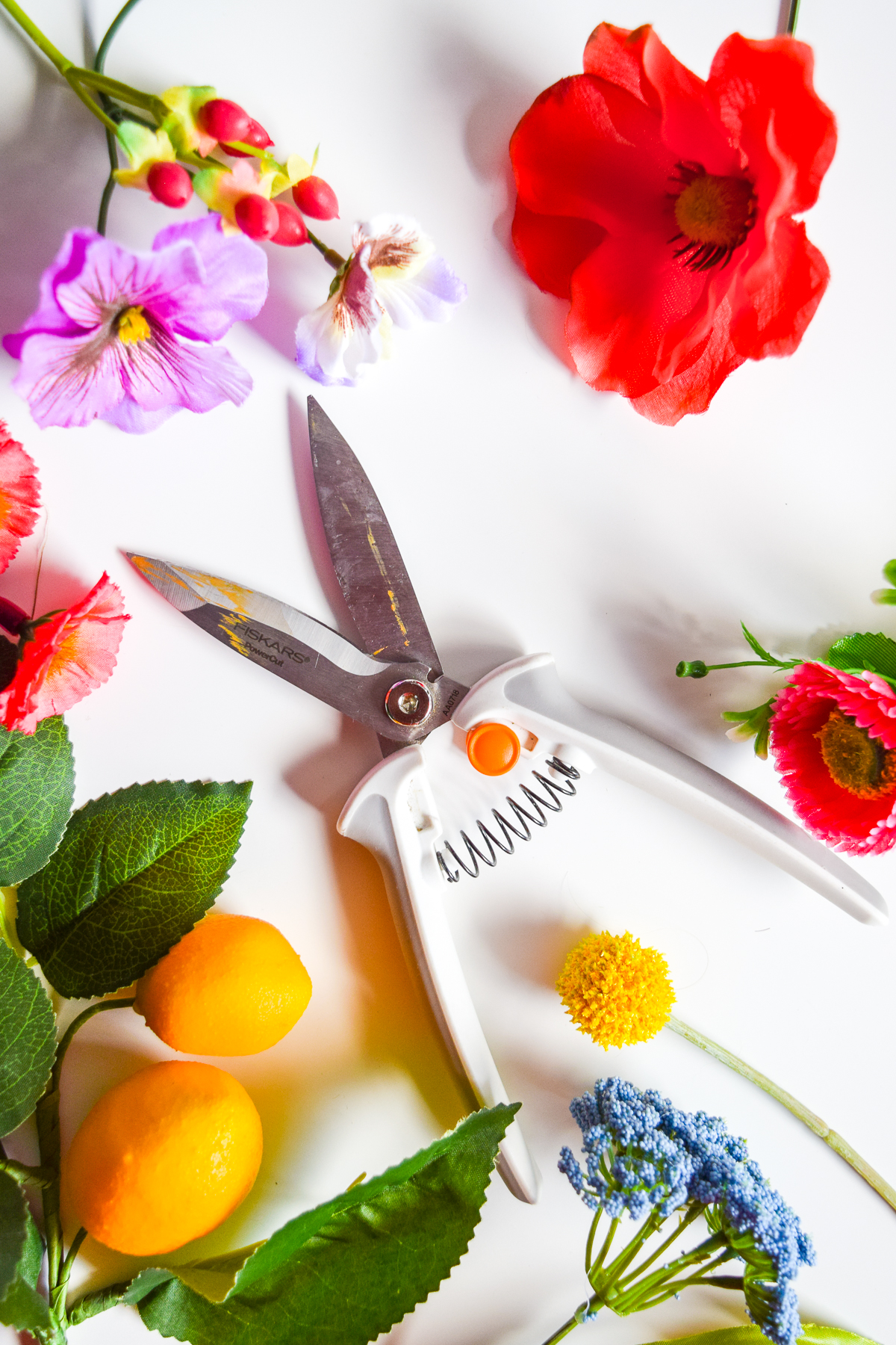 I've never done a nursery, but I do know how to make faux floral wall art - inspired by Rifle Paper Co. - and you can too! You just need the right tools. My Powercut Snips from Fiskars cut right through the wire stems, making them easy to position.