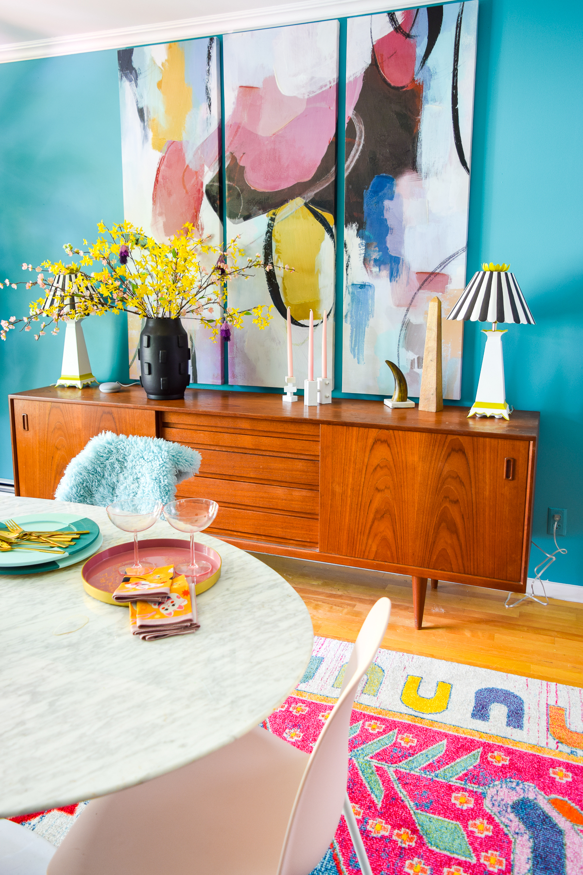 A mid century modern dining room, full of color, teak, marble, and color blocked walls. What's not to love? Come grab inspo and sources on the blog.