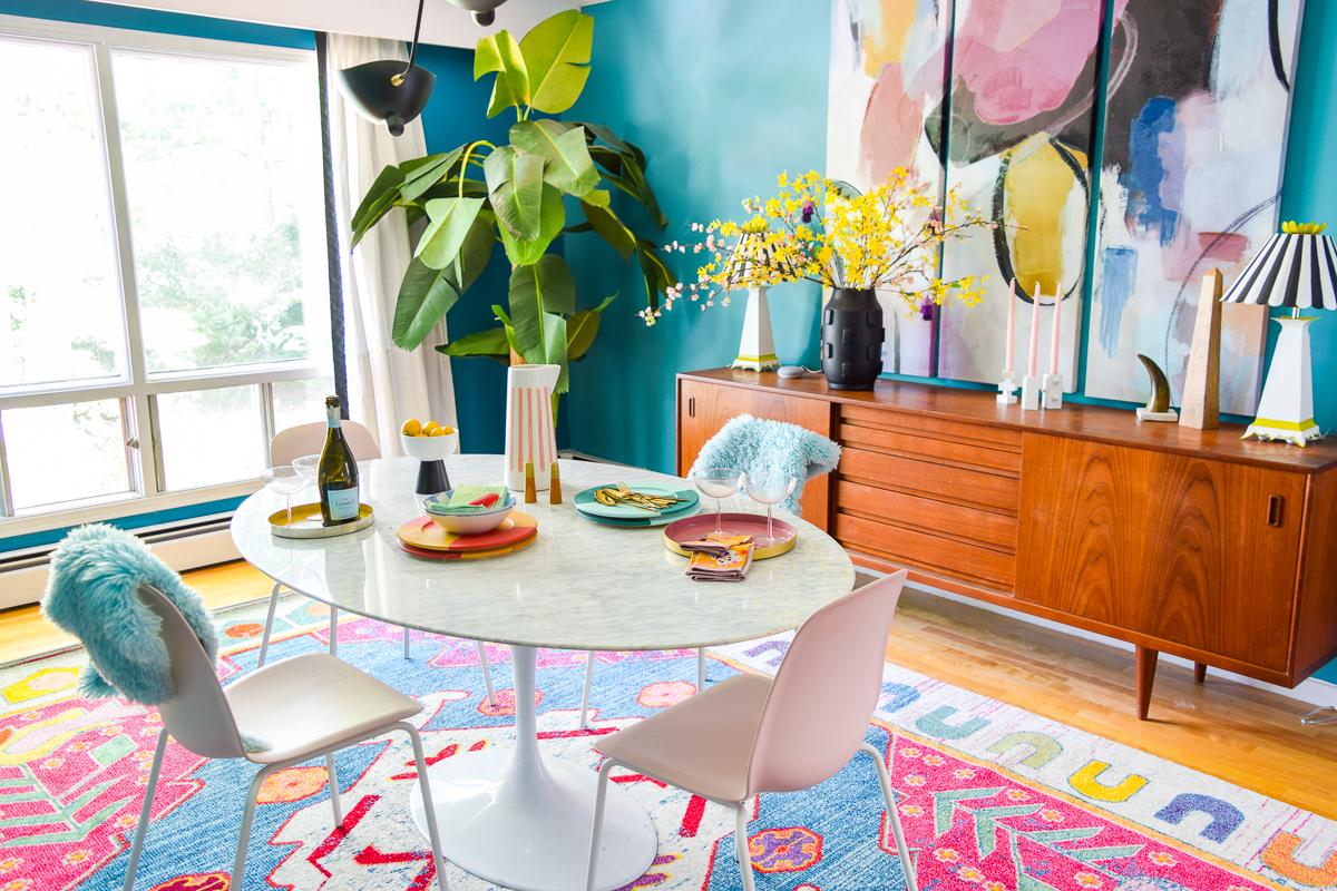 A mid century modern dining room, full of color, teak, marble, and color blocked walls. What's not to love? Come grab inspo and sources on the blog.