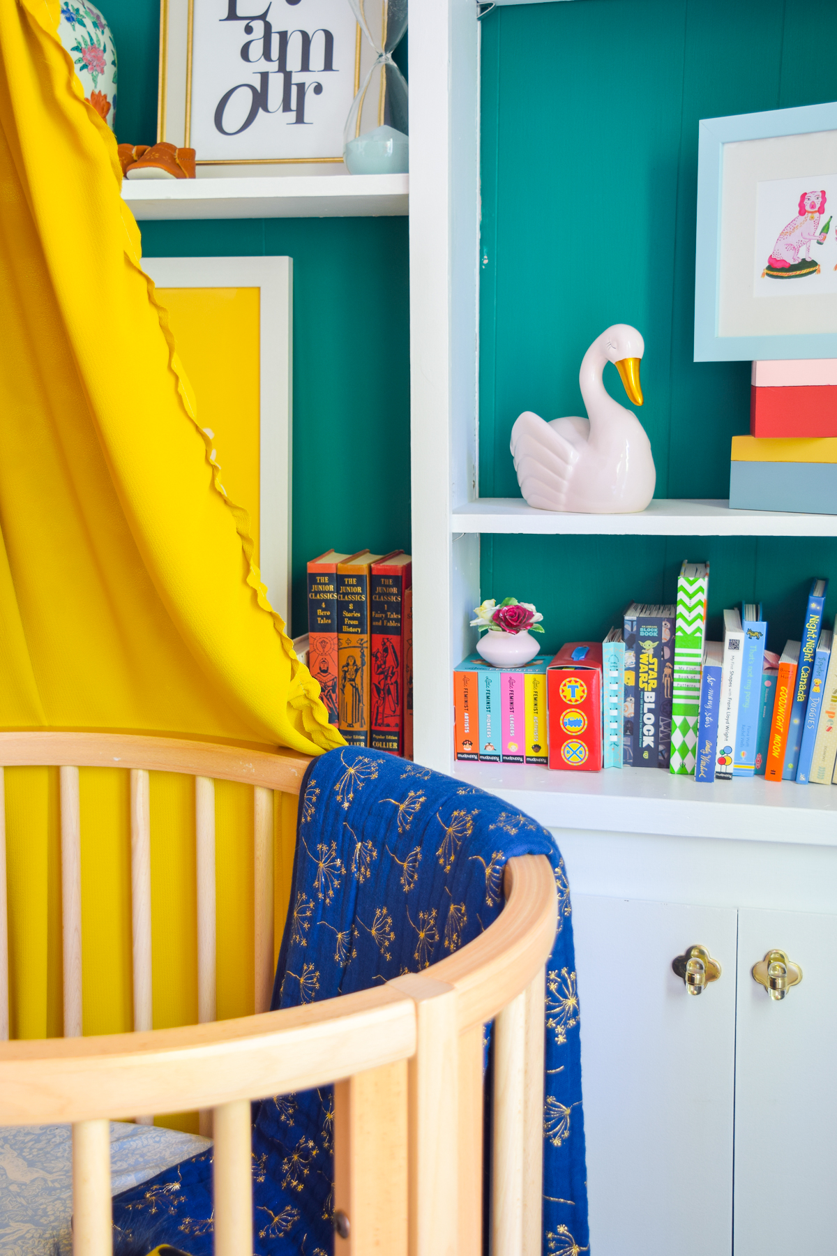 Our colorful baby girl nursery is full of pattern and texture. Between the swan rocker and the oval crib, what's not to love?