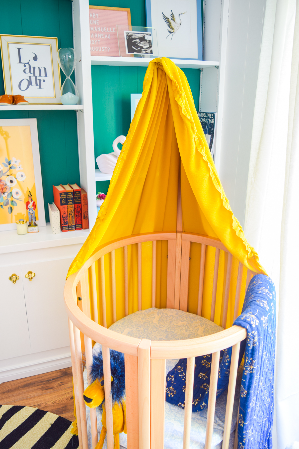 Our colorful baby girl nursery is full of pattern and texture. Between the swan rocker and the oval crib, what's not to love?