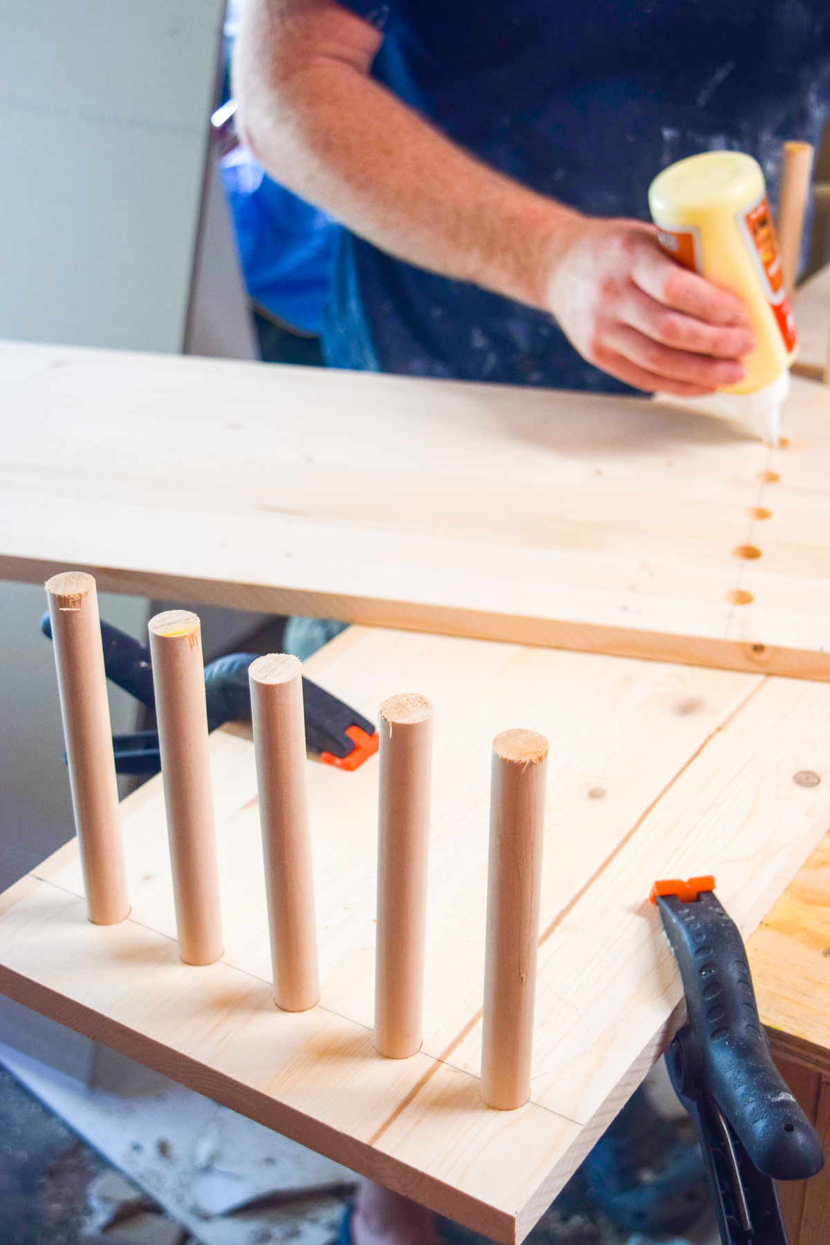 A wood console table DIY you can make without screws! Get the sleek mid century modern look using pine boards and dowels from the Home Depot. Grab the plans on the blog! A wood console table DIY you can make without screws! Get the sleek mid century modern look using pine boards and dowels from the Home Depot. Grab the plans on the blog!