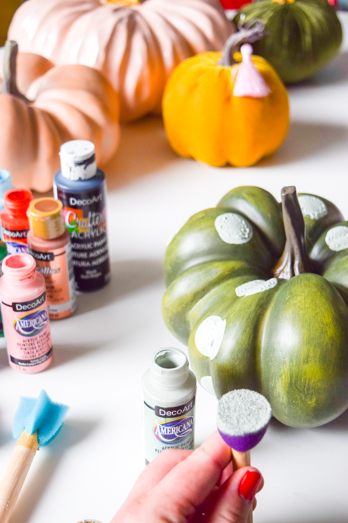 5 Colorful Pumpkin Painting Ideas that will bust you out of your creative rut, and have all your friends asking where you got such cool pumpkins this year. Using DecoArt's acrylic paints you can easily transfrom and re-use crafting pumpkins to create bold pops of colour.