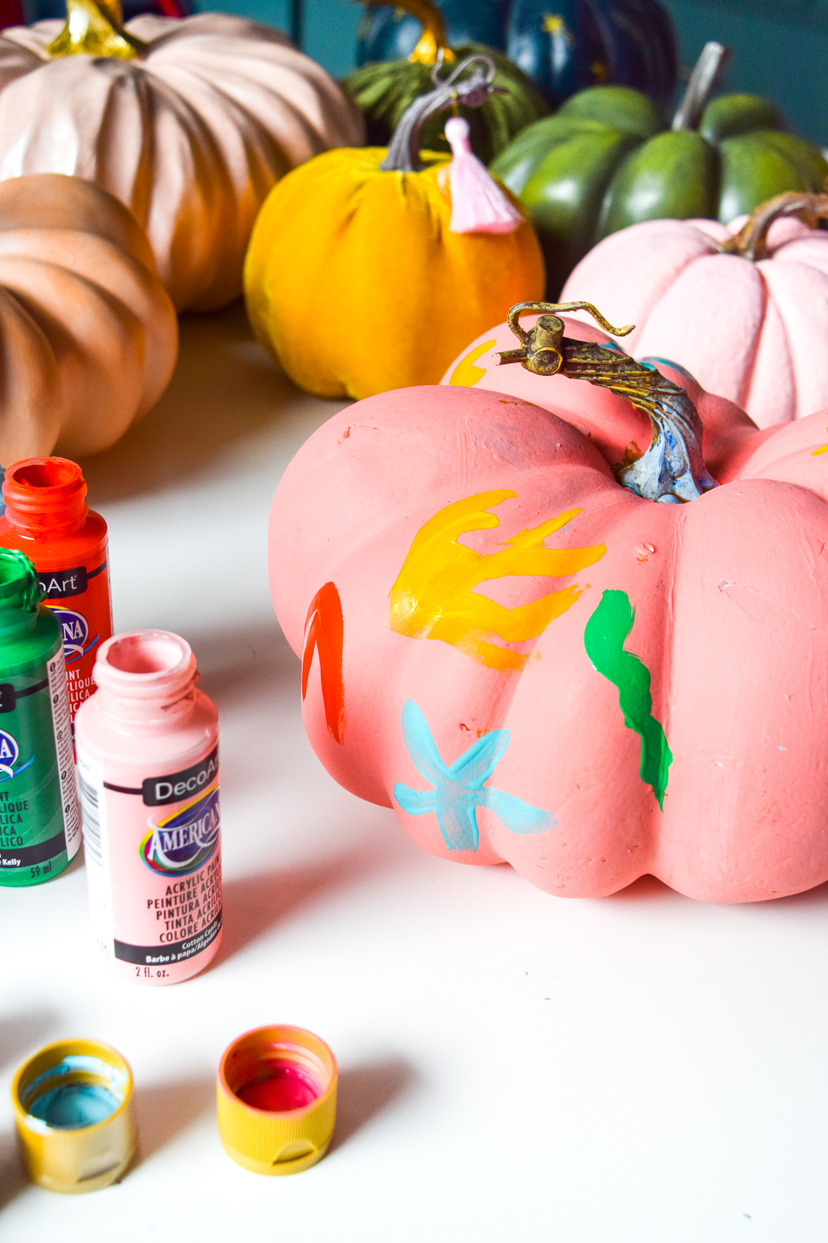 5 Colorful Pumpkin Painting Ideas that will bust you out of your creative rut, and have all your friends asking where you got such cool pumpkins this year. Using DecoArt's acrylic paints you can easily transfrom and re-use crafting pumpkins to create bold pops of colour.