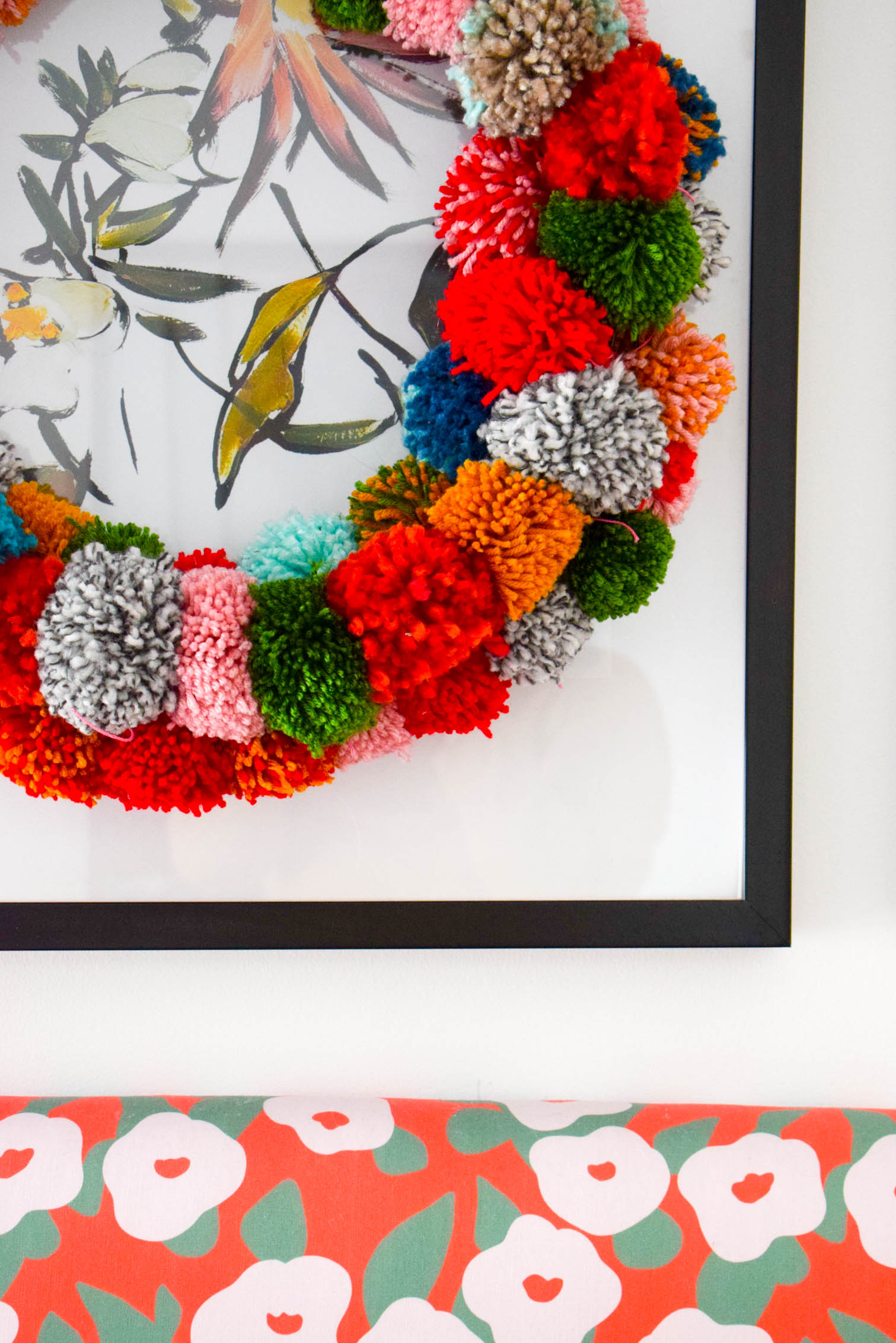 Make your own pom pom wreath this holiday season, and add a bold statement to your decor. This wreath is easy to make and a lot of fun to put together.