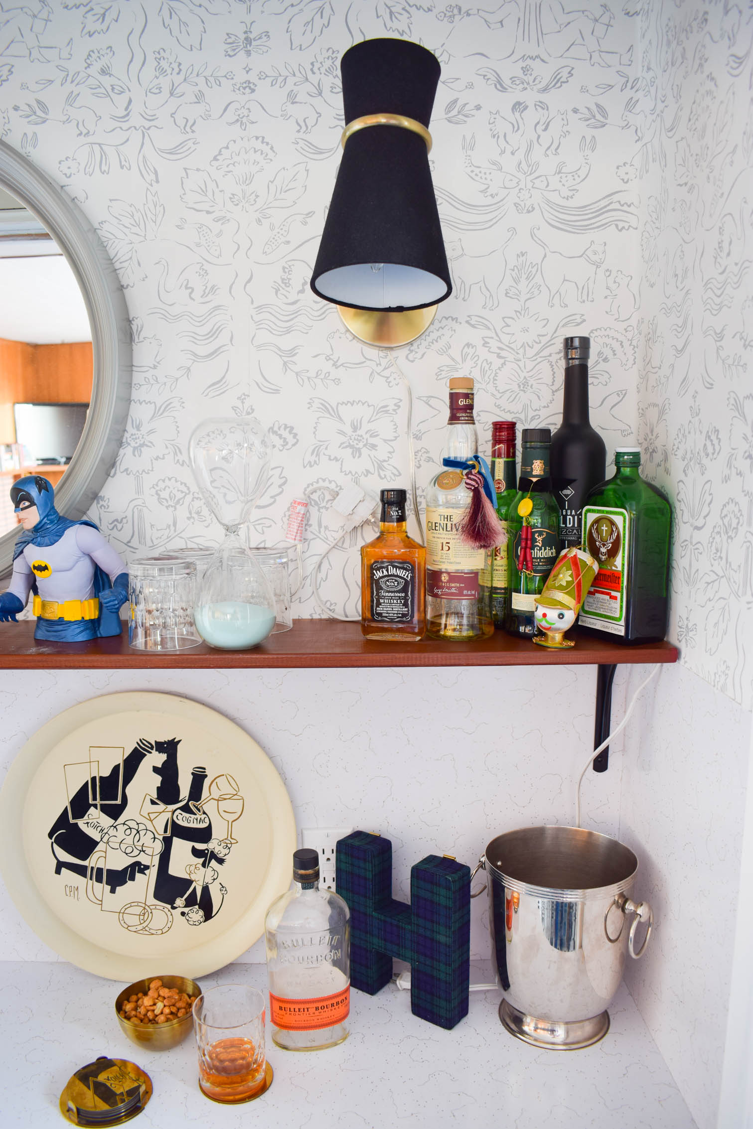 Our basement bar was a nightmare from the 70s, and now it's a clean modern space. With a few budget friendly updates we took it from drab to fab. Freshly painted cabinets, peel and stick floor tiles, and new wallpaper are just what the space needed!