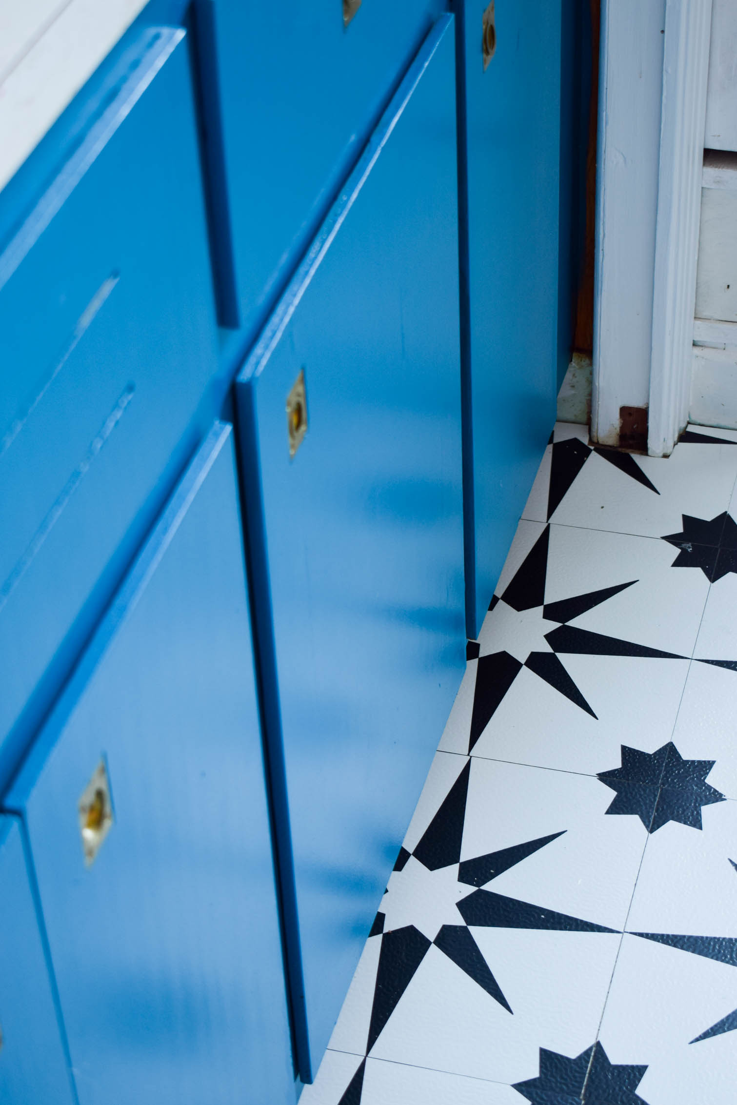 Our basement bar was a nightmare from the 70s, and now it's a clean modern space. With a few budget friendly updates we took it from drab to fab. Freshly painted cabinets, peel and stick floor tiles, and new wallpaper are just what the space needed!