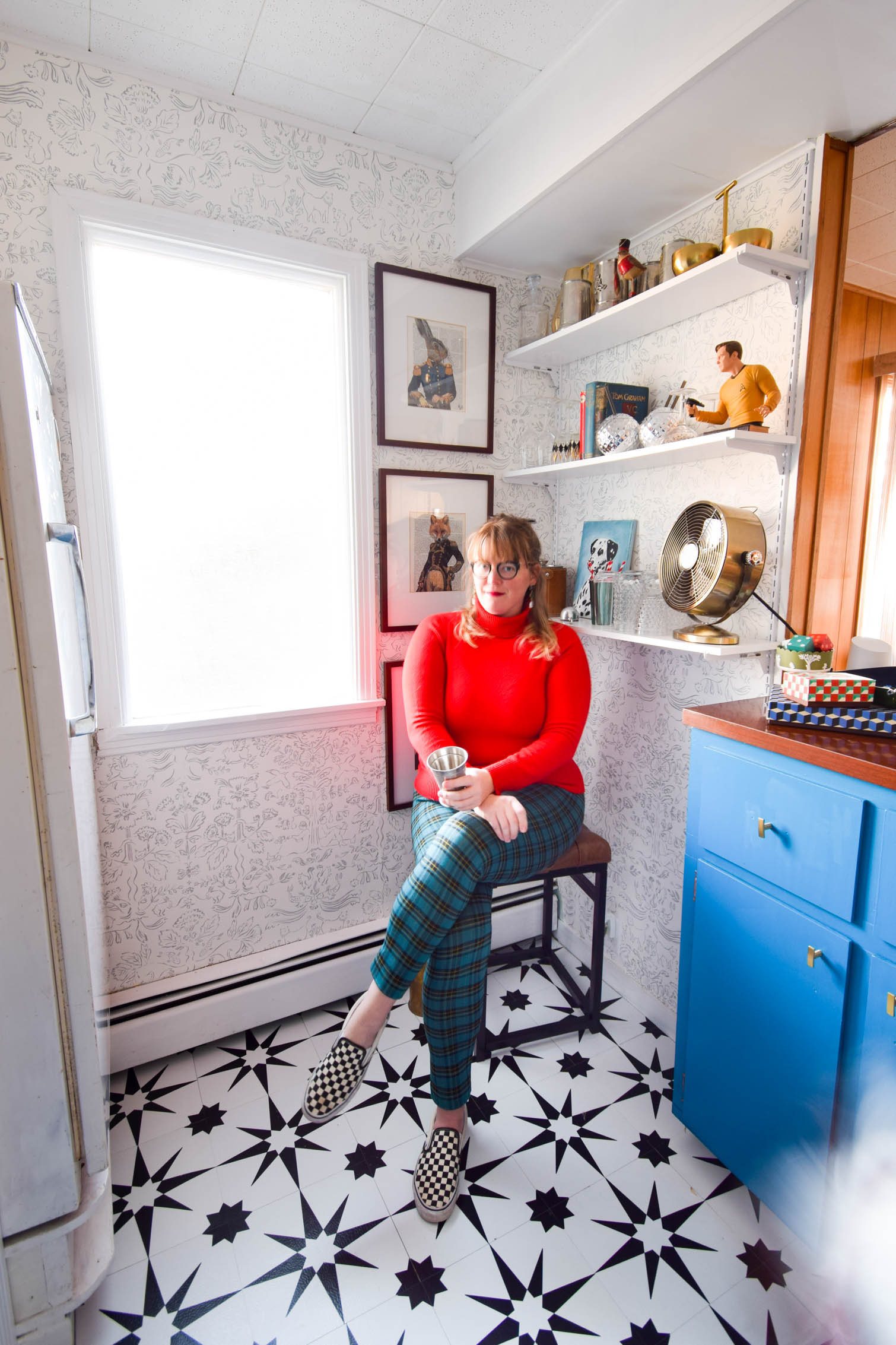 Our basement bar was a nightmare from the 70s, and now it's a clean modern space. With a few budget friendly updates we took it from drab to fab. Freshly painted cabinets, peel and stick floor tiles, and new wallpaper are just what the space needed!