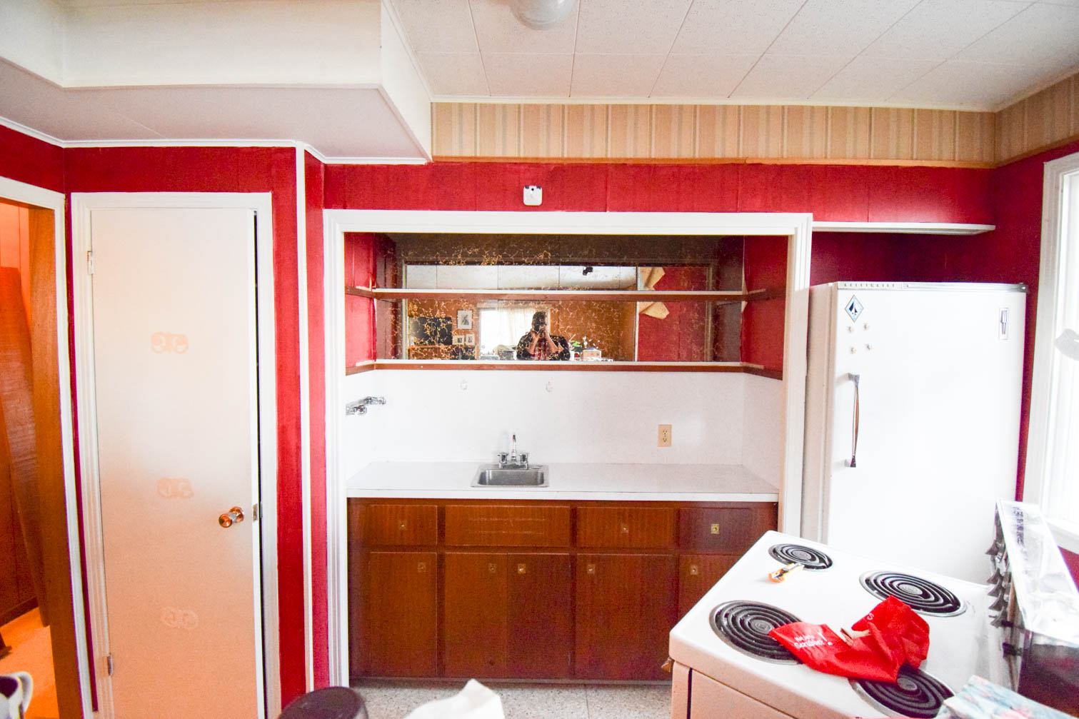 Our basement bar was a nightmare from the 70s, and now it's a clean modern space. With a few budget friendly updates we took it from drab to fab. Freshly painted cabinets, peel and stick floor tiles, and new wallpaper are just what the space needed!