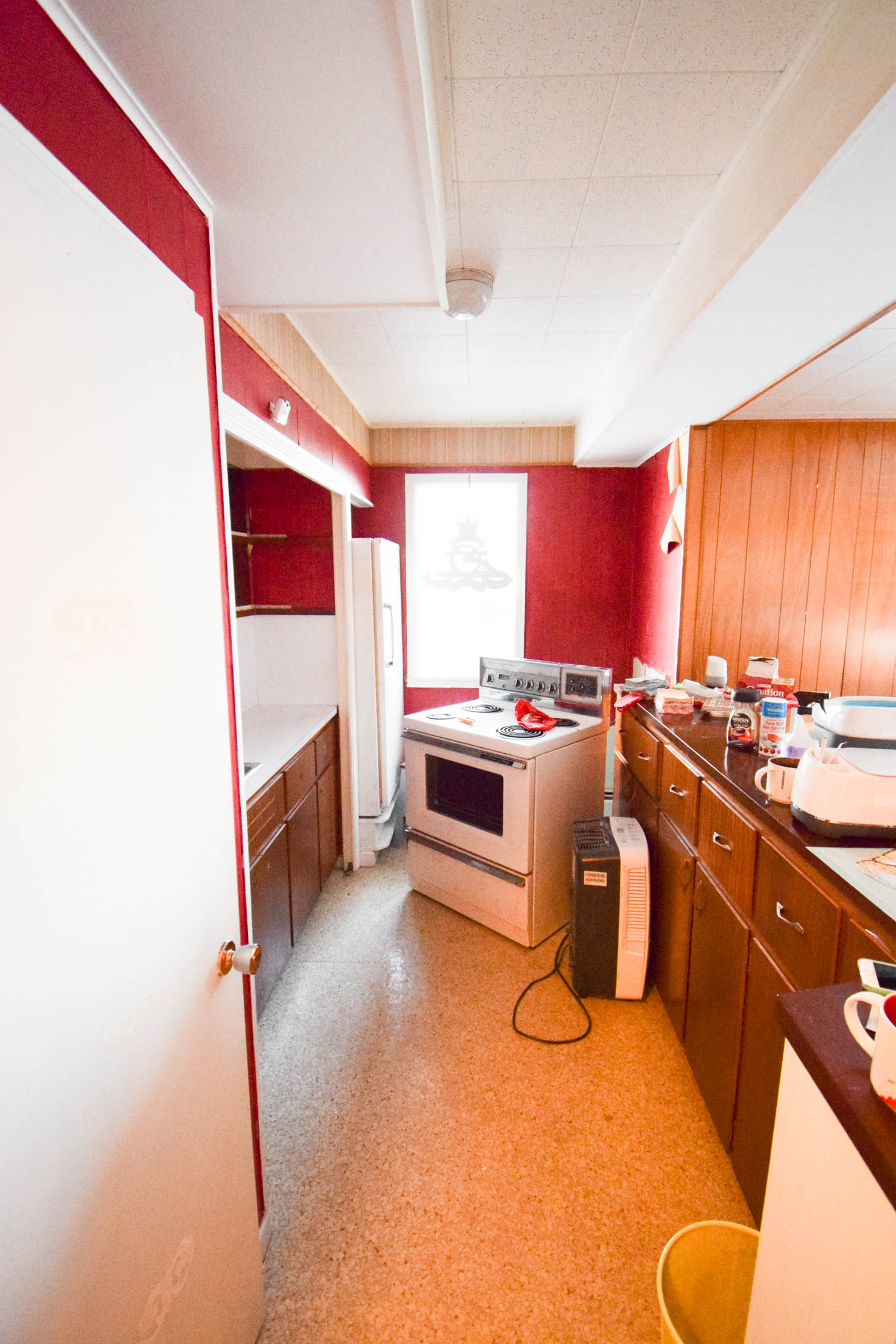 Our basement bar was a nightmare from the 70s, and now it's a clean modern space. With a few budget friendly updates we took it from drab to fab. Freshly painted cabinets, peel and stick floor tiles, and new wallpaper are just what the space needed!