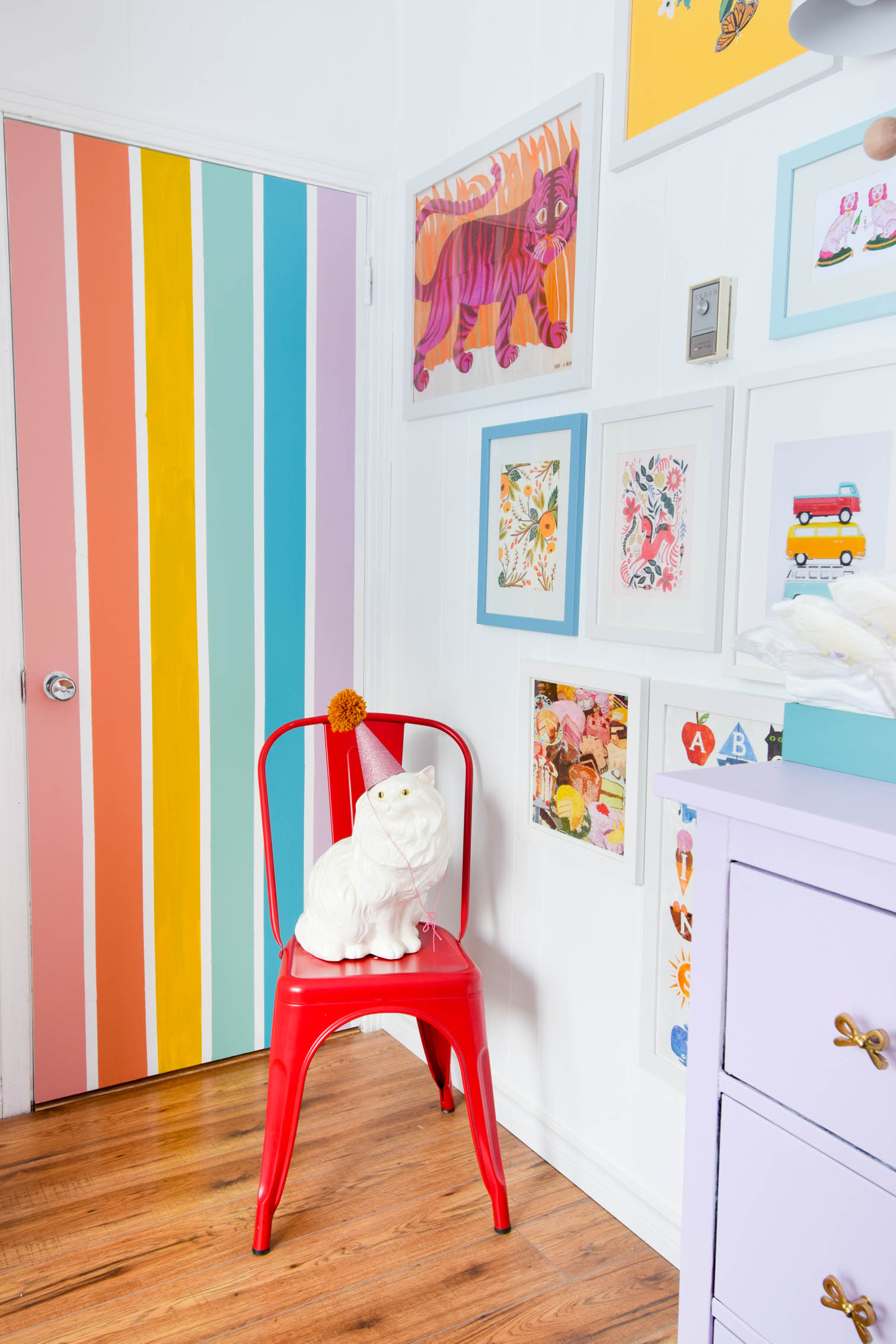 A DIY rainbow nursery door is how you nail two trends in one project! Get rainbows and murals all in one, and add a major pop of color to any space. A DIY rainbow nursery door is how you nail two trends in one project! Get rainbows and murals all in one, and add a major pop of color to any space.