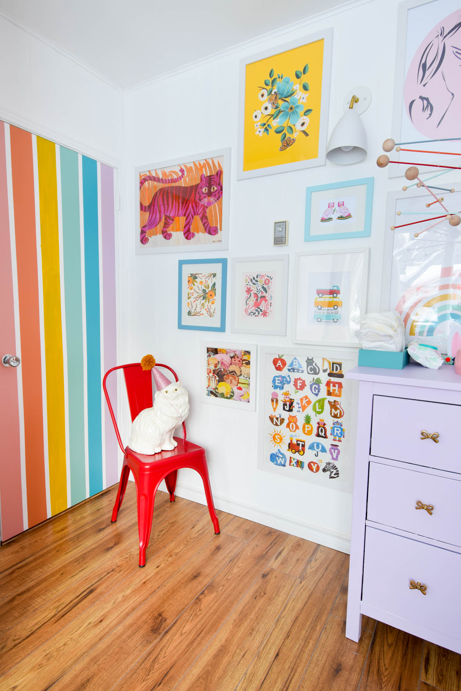 A DIY rainbow nursery door is how you nail two trends in one project! Get rainbows and murals all in one, and add a major pop of color to any space. A DIY rainbow nursery door is how you nail two trends in one project! Get rainbows and murals all in one, and add a major pop of color to any space.