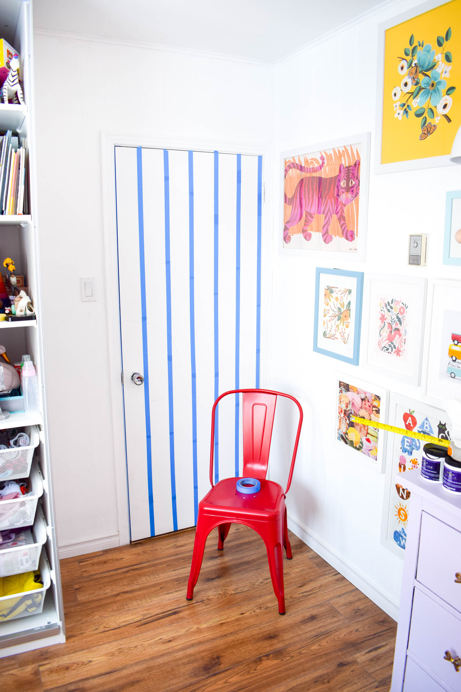 A DIY rainbow nursery door is how you nail two trends in one project! Get rainbows and murals all in one, and add a major pop of color to any space.