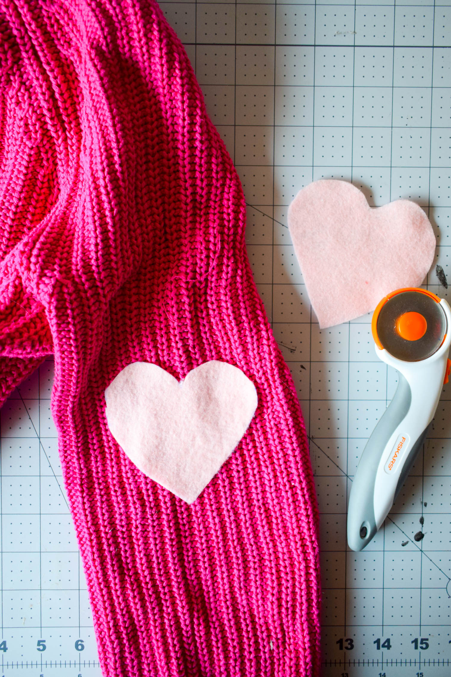 DIY Heart elbow patches are the easiest way to refashion a sweater. Using felt and a needle + thread, you can add adorable style in a few minutes to any top