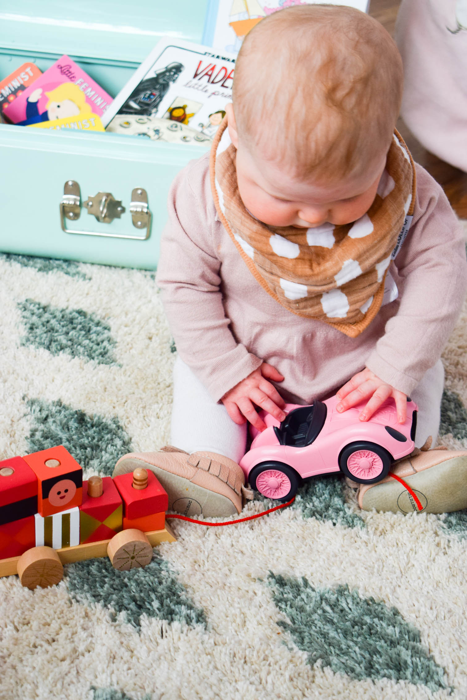 Creating stimulating and enriching activities for a baby can't be tricky, so I've created a toy box full of colourful baby play time ideas.