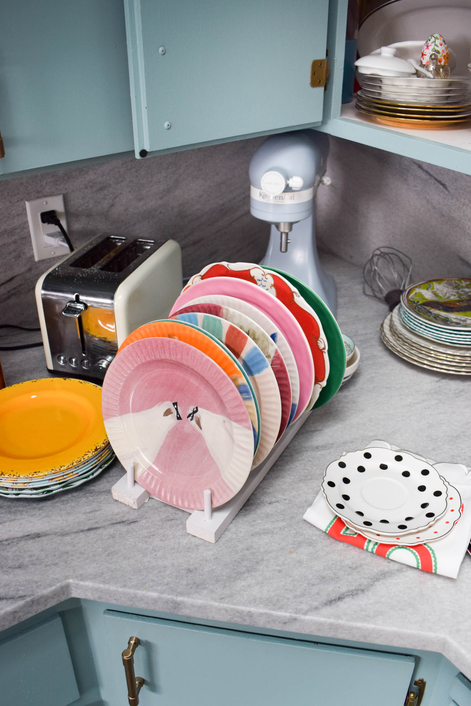 Make some DIY plate racks to organize all your kitchen dishes! You can make yours in a day using wood scraps