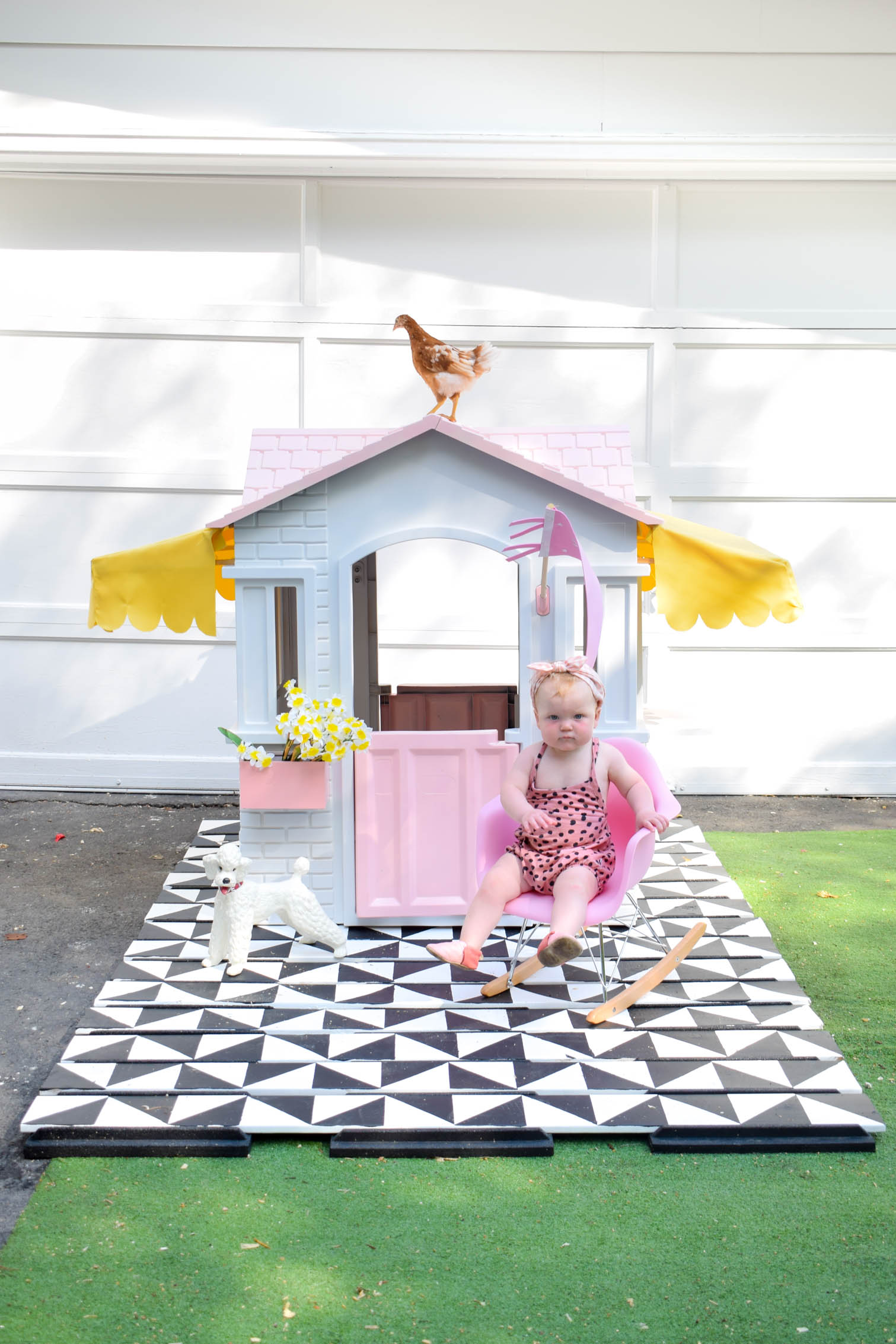 I completed a Mid Century Playhouse Makeover with a floating deck, painted to look like tiles. Easy! Come grab the tutorial and see the pics.