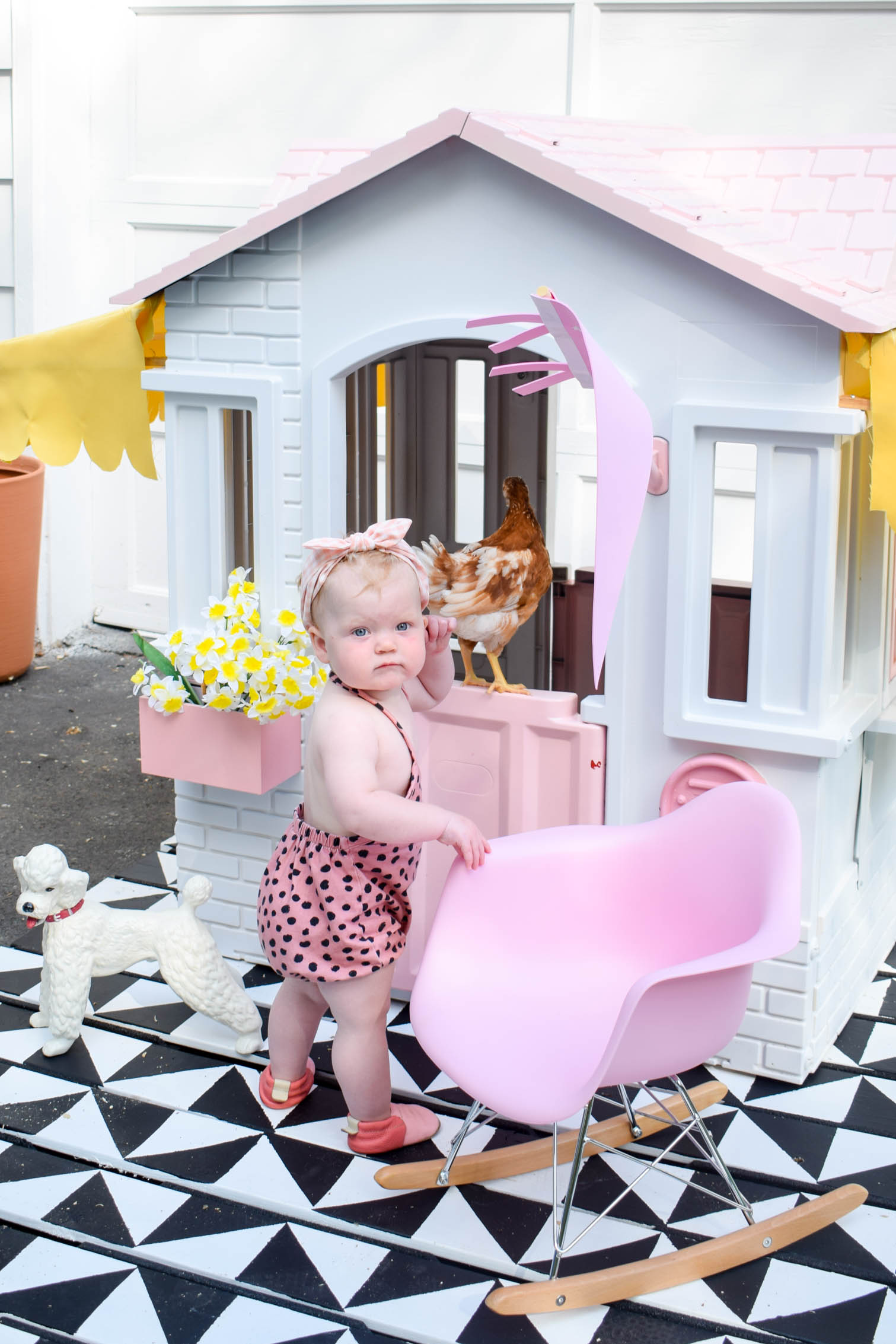 I completed a Mid Century Playhouse Makeover with a floating deck, painted to look like tiles. Easy! Come grab the tutorial and see the pics.