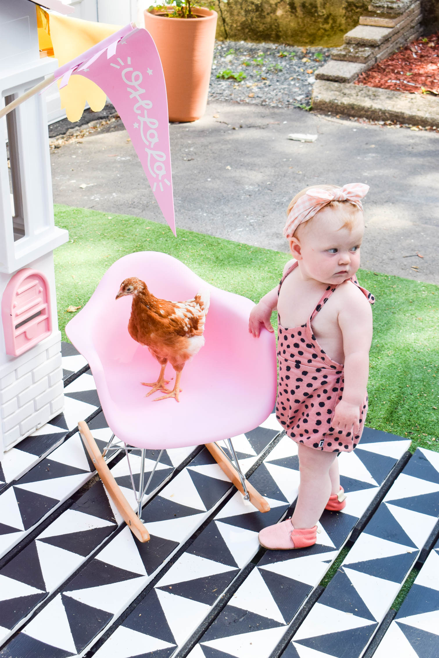 I completed a Mid Century Playhouse Makeover with a floating deck, painted to look like tiles. Easy! Come grab the tutorial and see the pics.